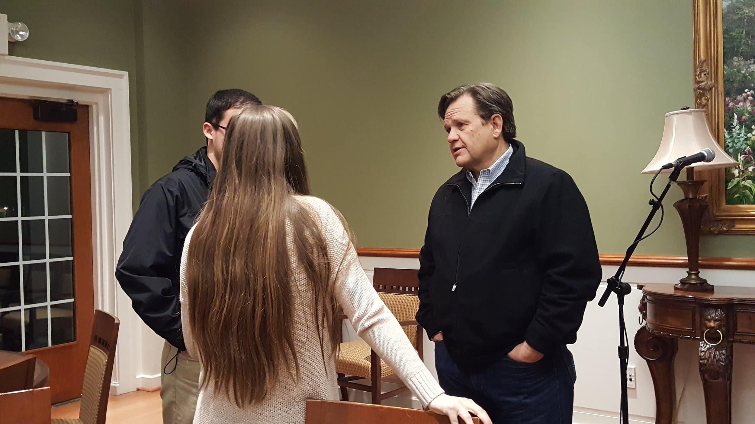 Senior Will Goubert and junior Tori Sheriff talk with NGU President Gene Fant after the forum.&nbsp;