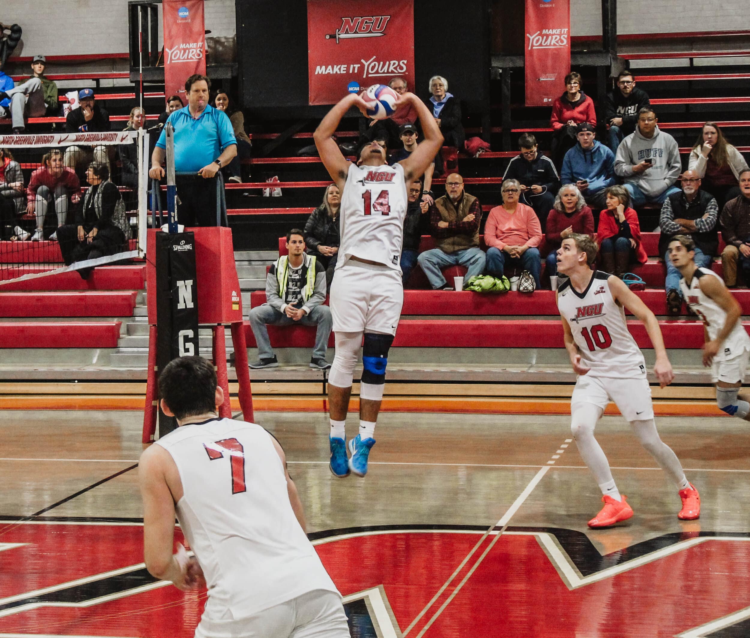 Sophomore Sergio Carrillo (14) sets the ball to his teammate.