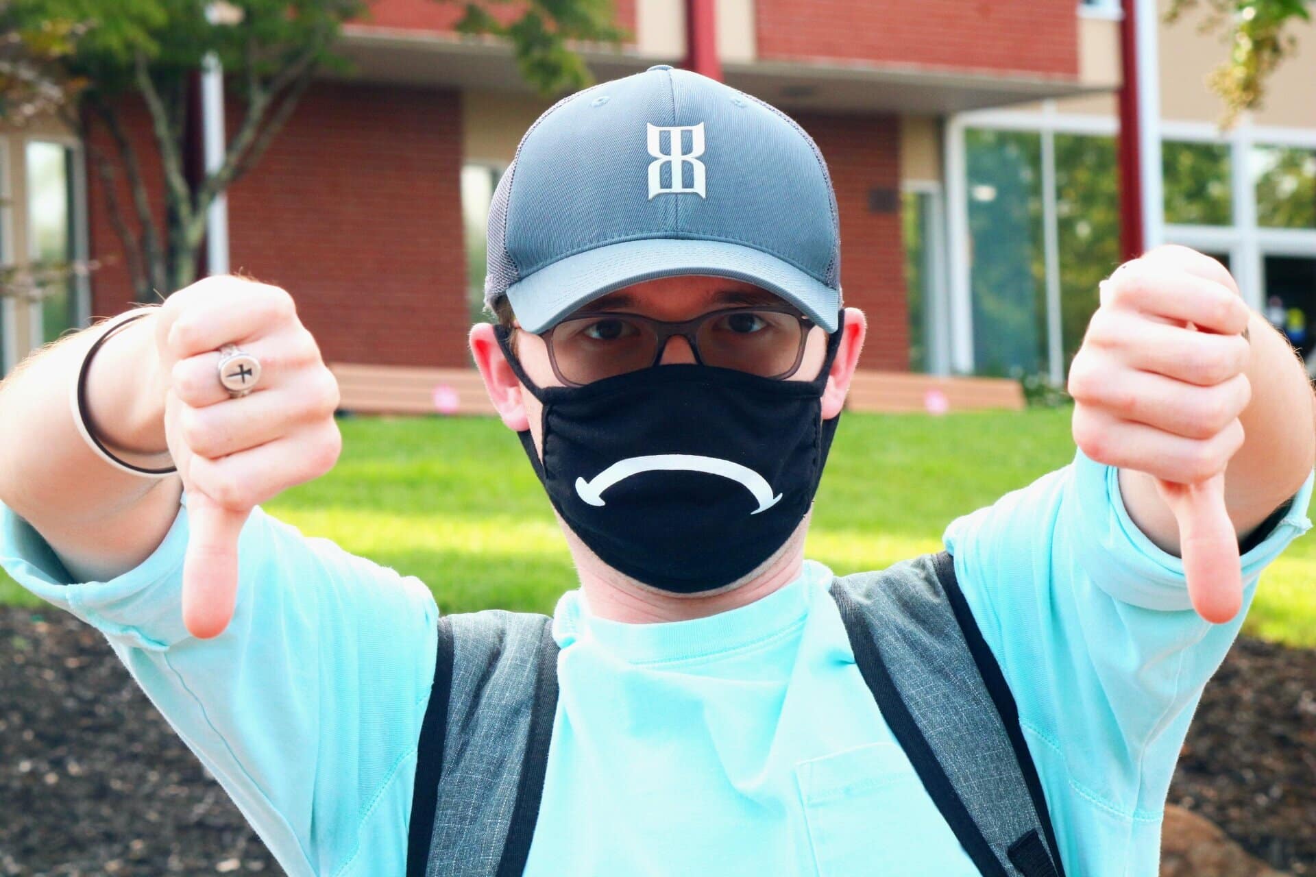 Austin uses his mask to show his professors how he feels about assignments. He often has a smile until a professor mentions spending six hours in the studio.