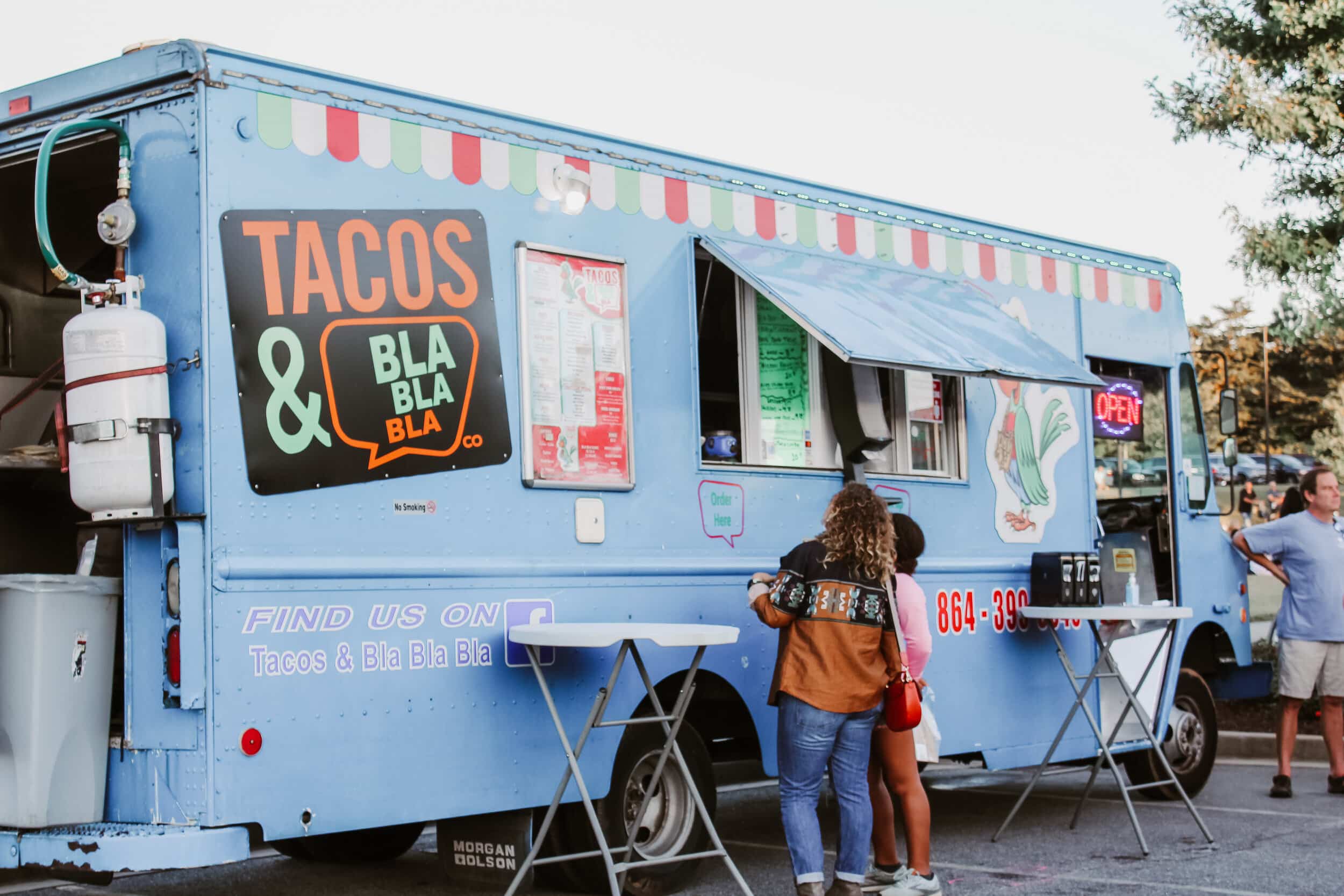 Tacos &amp; Bla Bla Bla, a family friendly Mexican restaurant based in Simpsonville, S.C., selling customers food from their food truck.