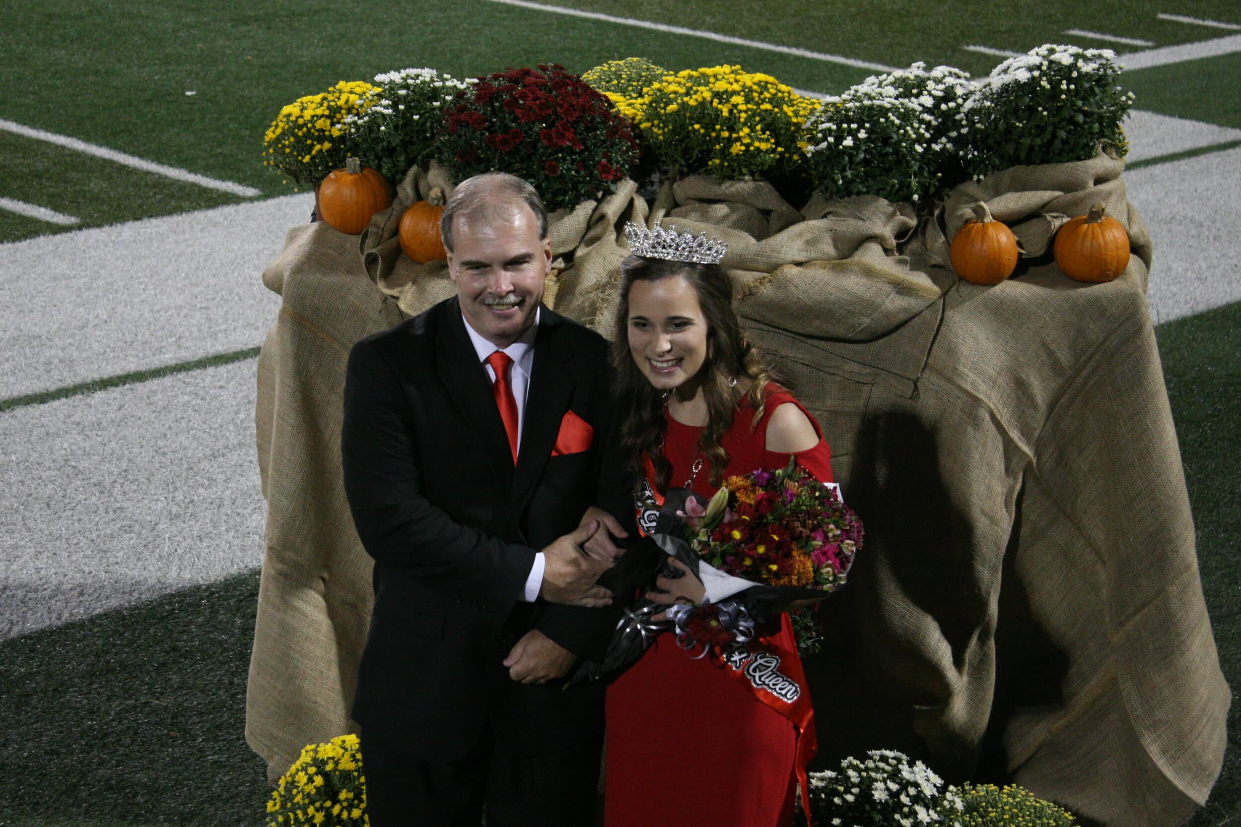 Hawthorne shows her joy while posing with her father.