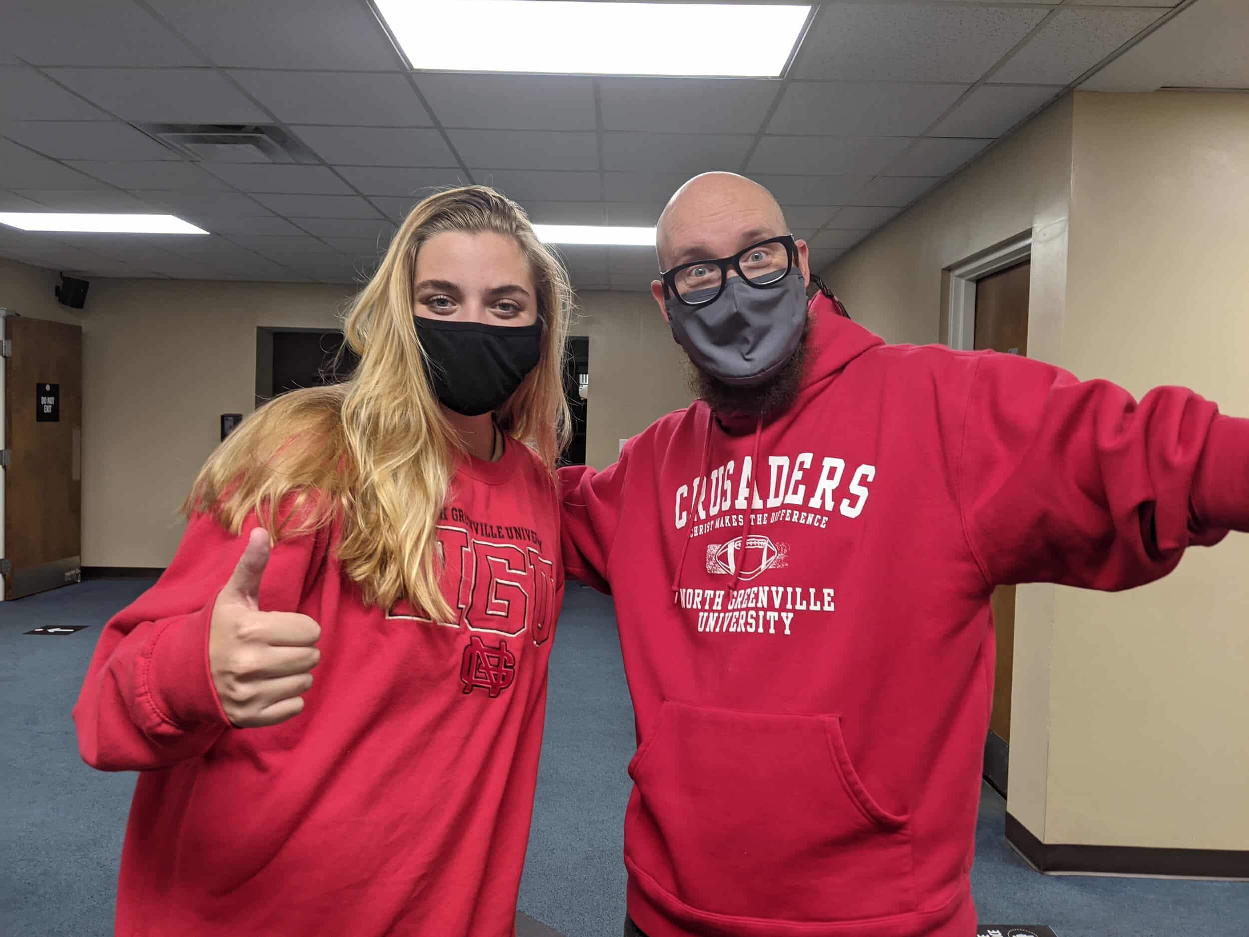 Sophomore worship studies major Rainey Dinkins and Campus Ministry and Student Engagement Team Vice President Jody Jennings show off their NGU apparel after BCM.