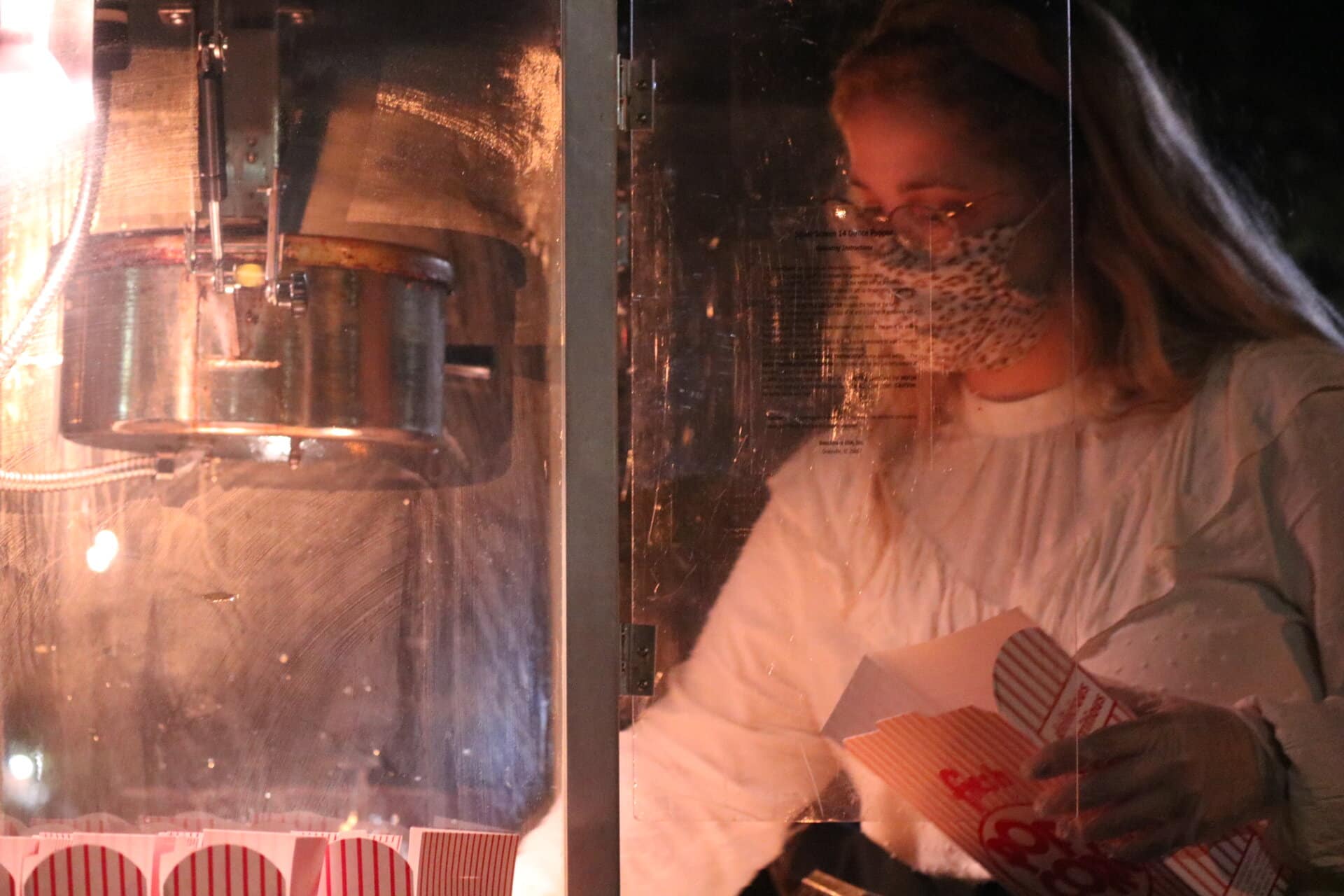 Senior marketing major Leilani Mullinax serves up popcorn for the students.