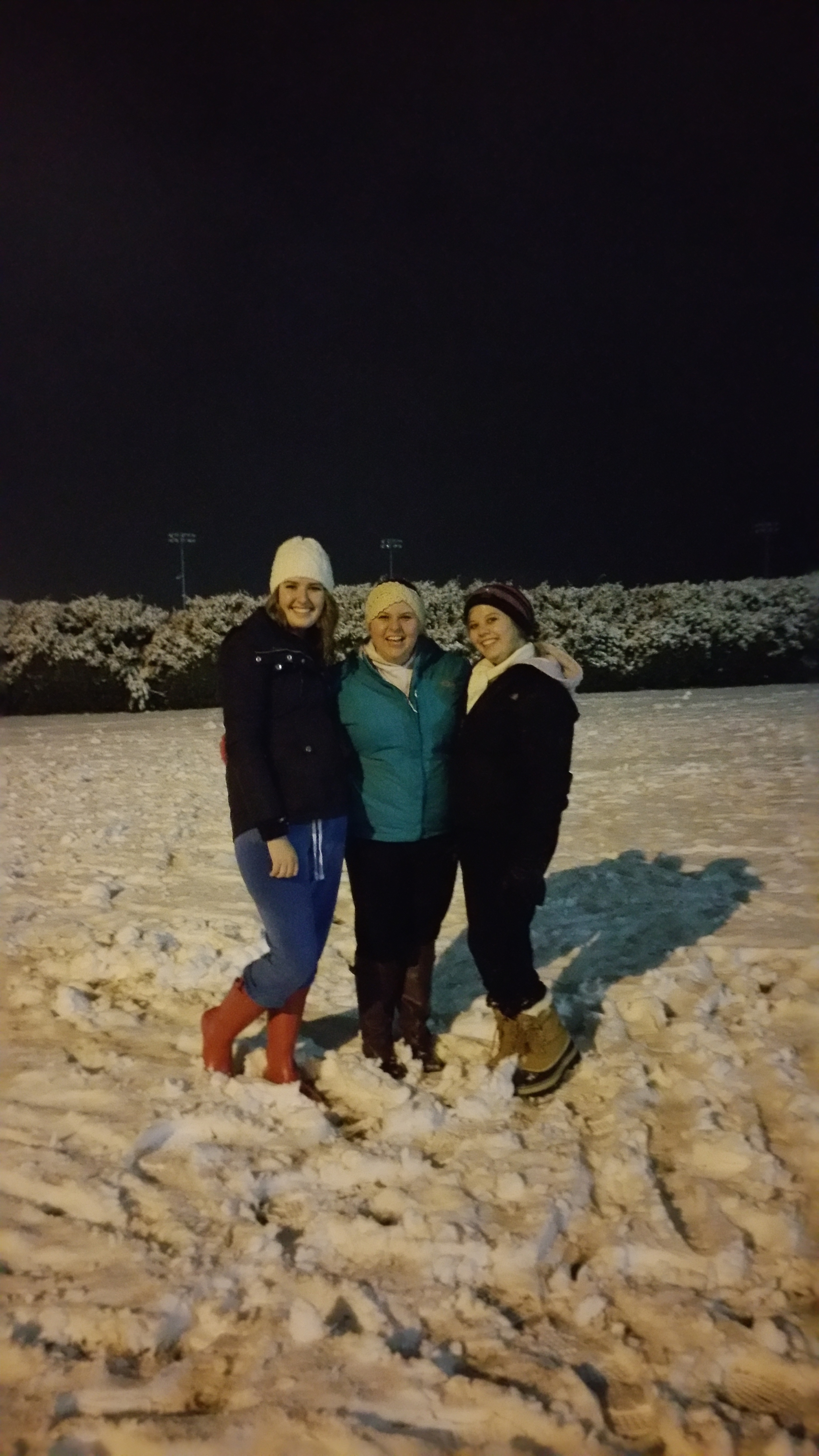 Late night snowball fights and sledding made for a good group picture opportunity. (L to R: Alex Miller, Hayden Harris, Megan Conley) Photo by Jori Edgington