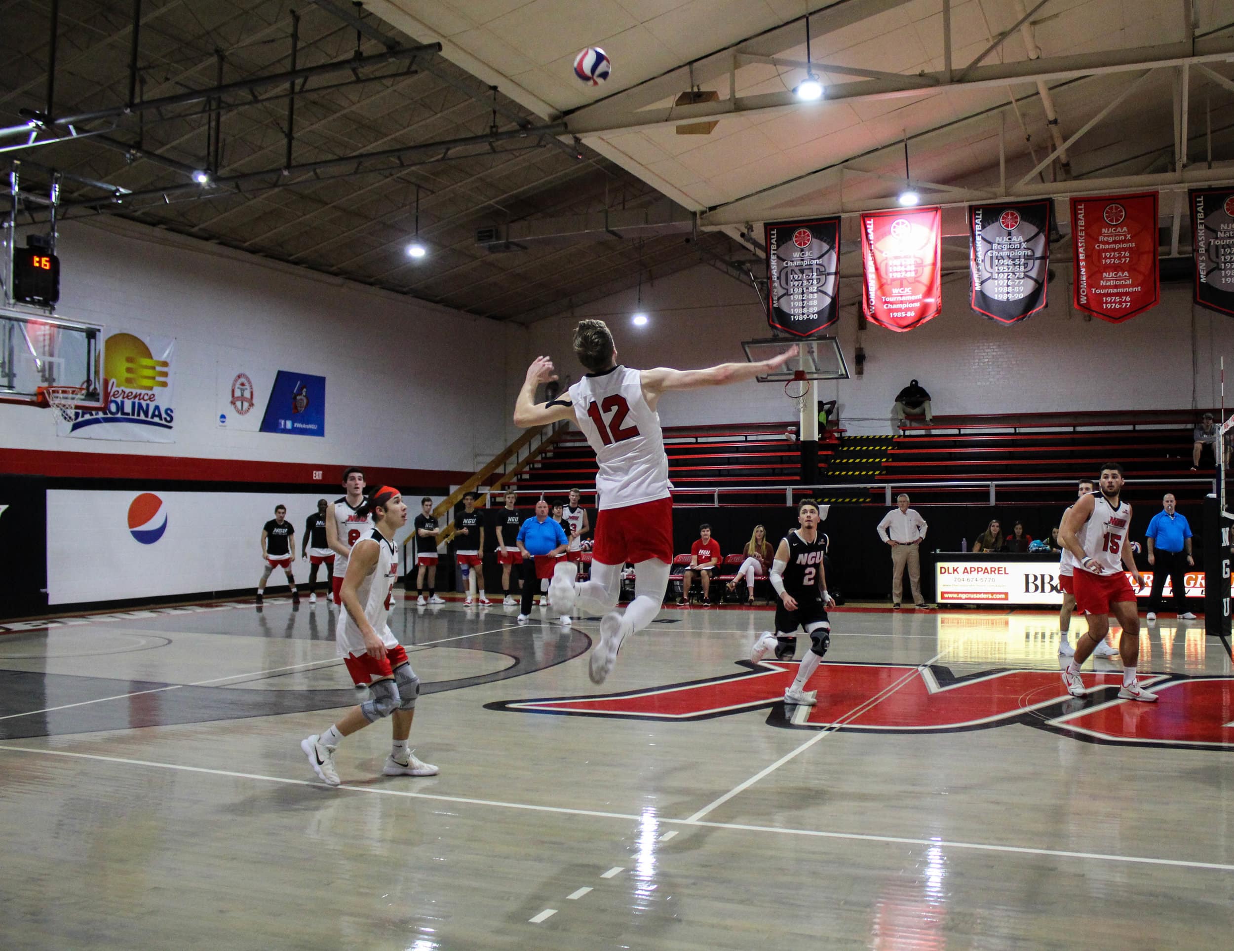 Aaron Campbell (12) prepares to hit the ball as it comes soaring over the centerline.