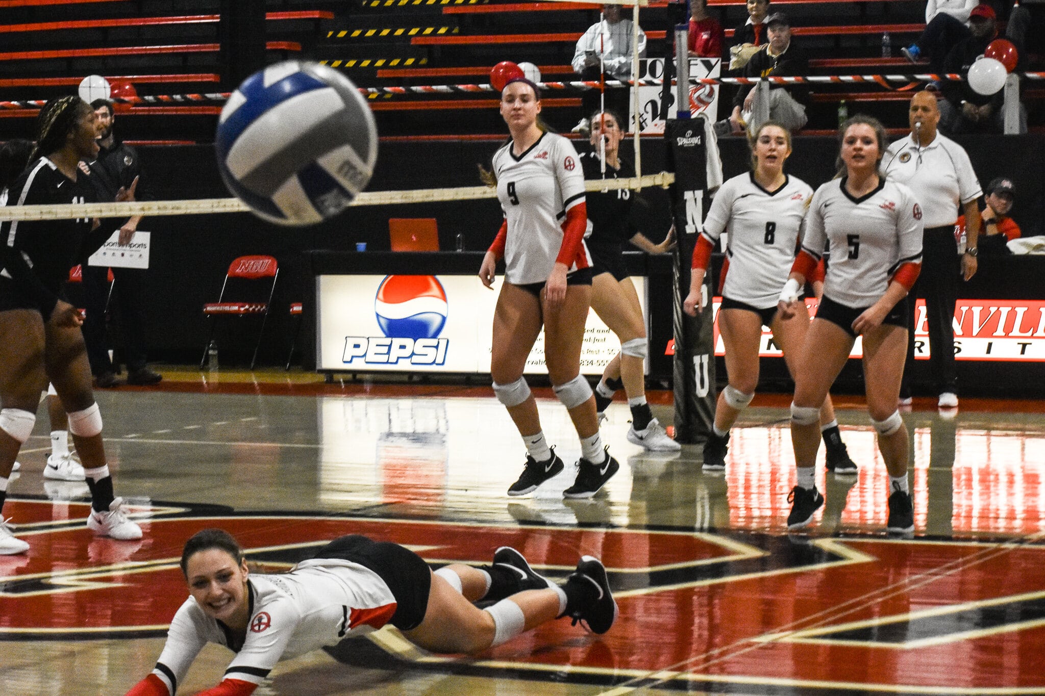 Sophomore Paige Beisecker (2) misses hitting the ball to keep it in play.