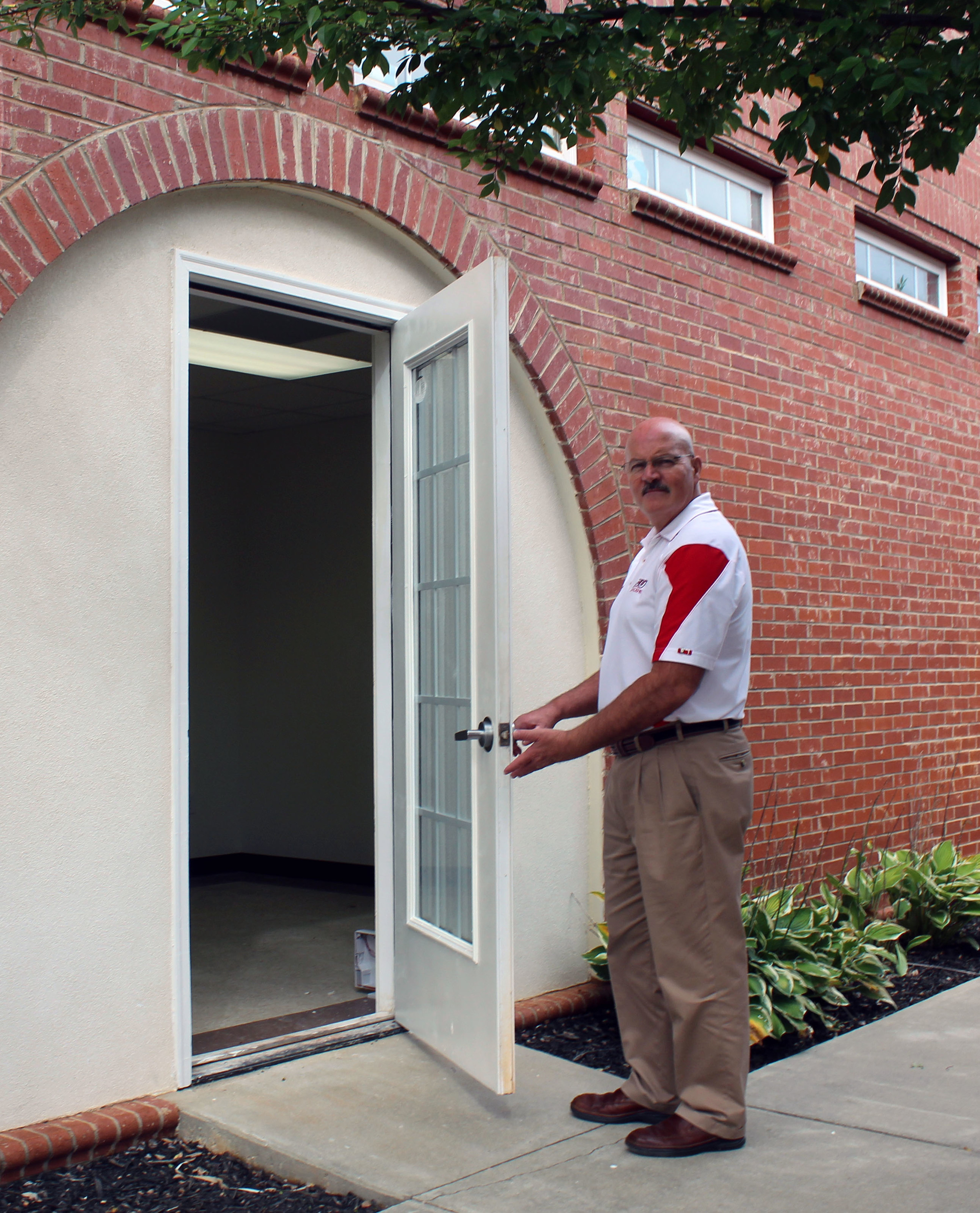 Gary Southern welcomes students to a new printing center coming to campus in October.Photo by Steven Goransky, The Vision staff