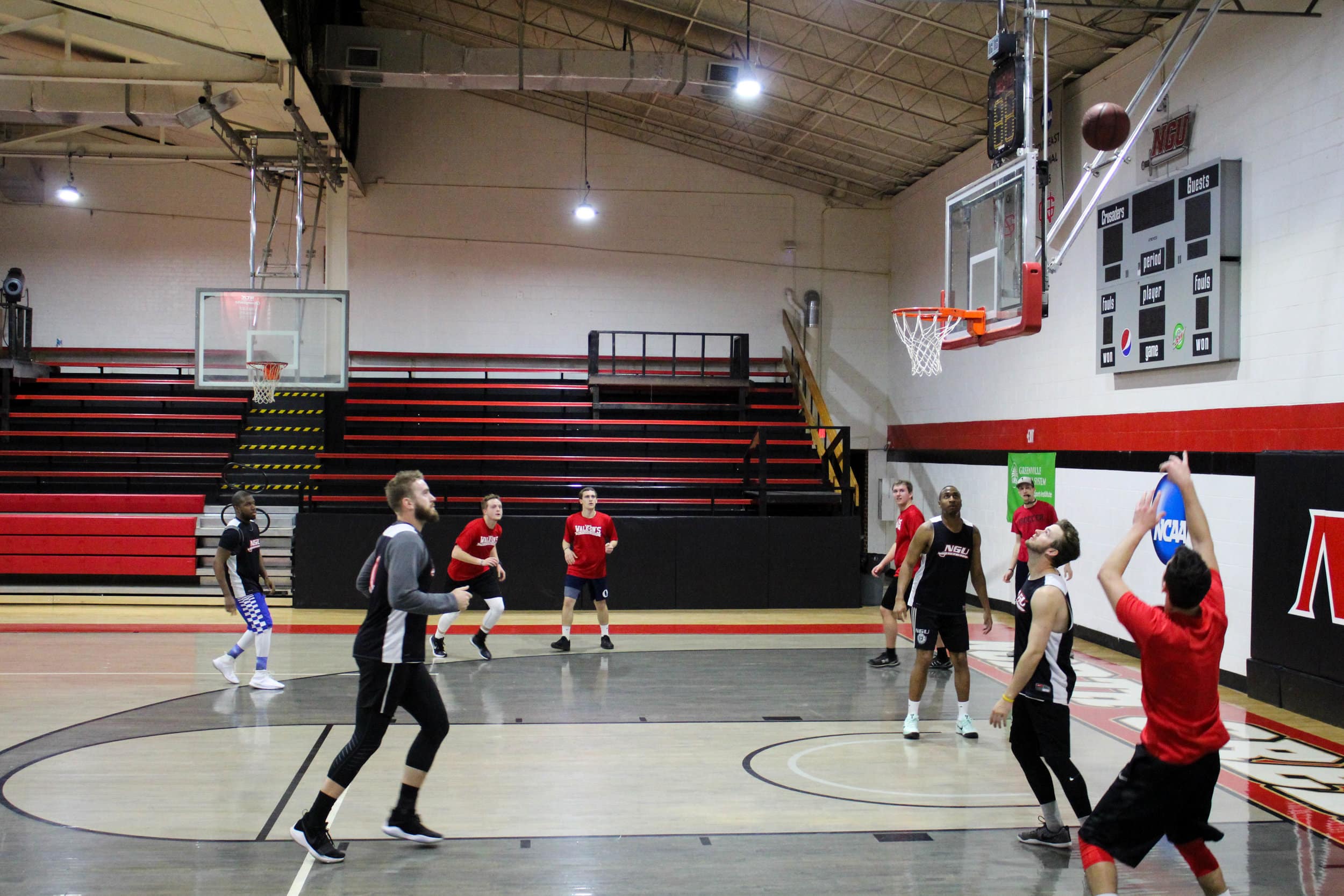 Aydan Fields shoots a three pointer in the The Walk-Ons game against NGU alumni.