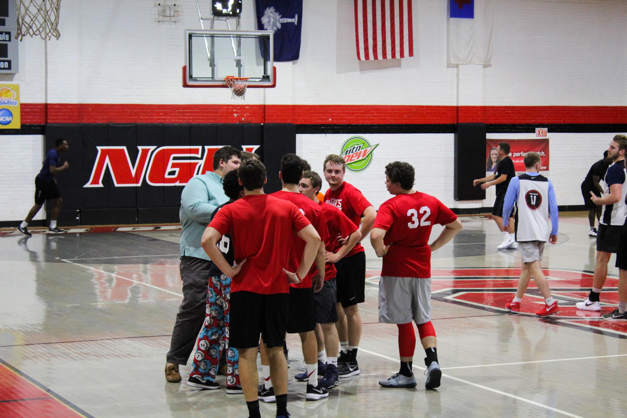 "The Walk-Ons huddle together while coach Bo Felton gives them a pep talk and game plan for going forward.