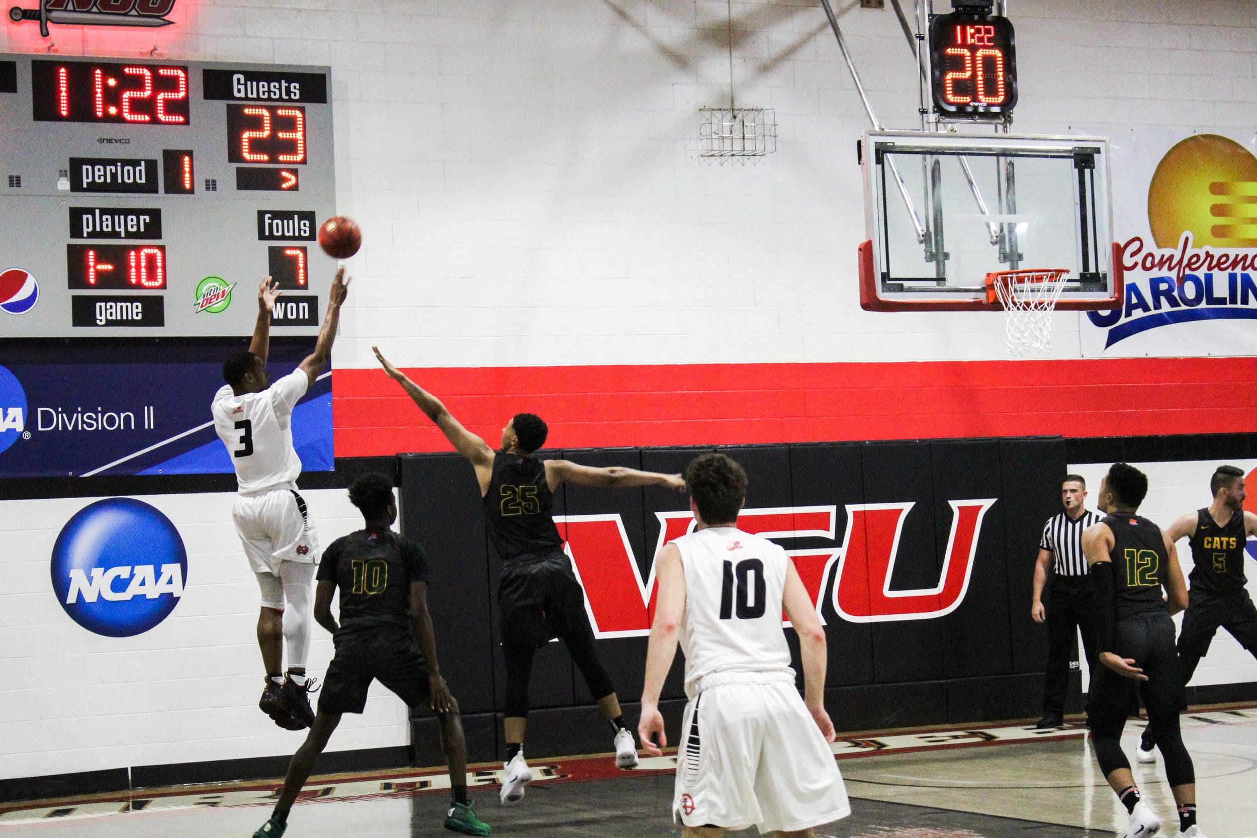 Sophomore, Kovi Tate (3) shoots a three pointer with twenty seconds left on the shot clock.