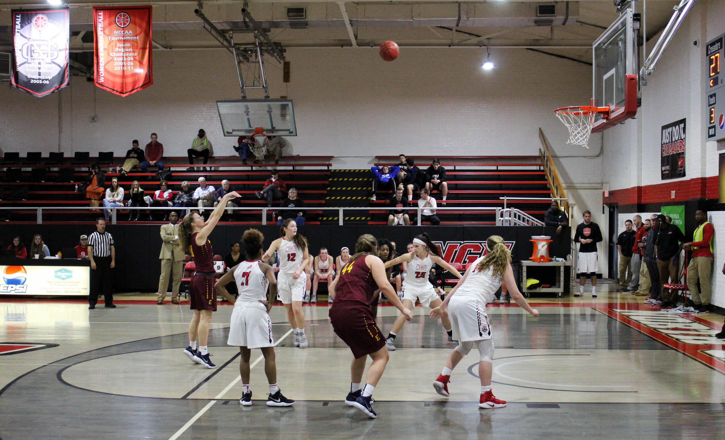 Savannah Hughes (21), Ayano Shelton (12), Elizabeth Trentham (25)&nbsp;and Karen Donehew (14) box out Emmanuel Colleges players and get ready to catch the rebound.