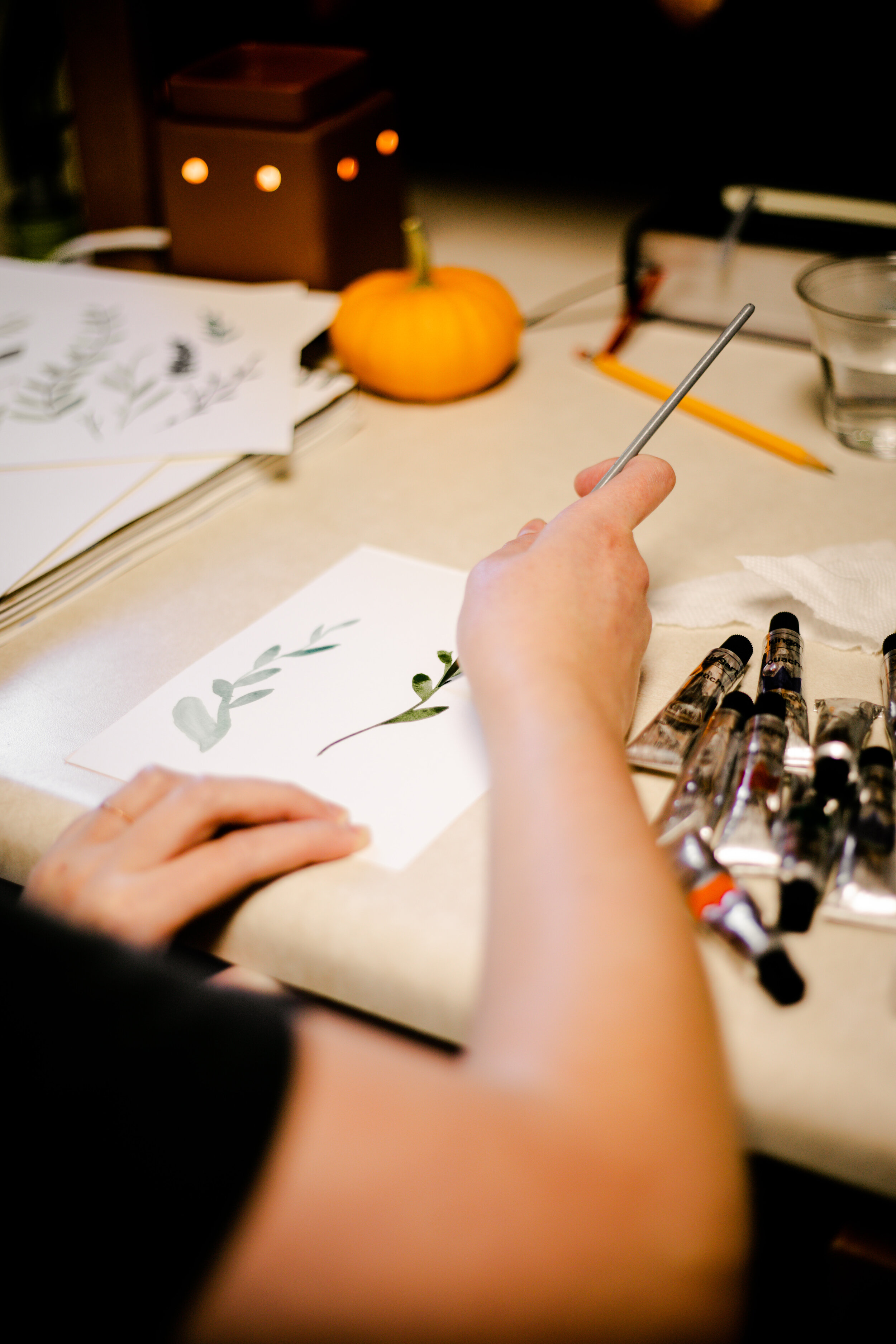 Her specialty is hand painting colorful strokes of various forms of greenery and plants.