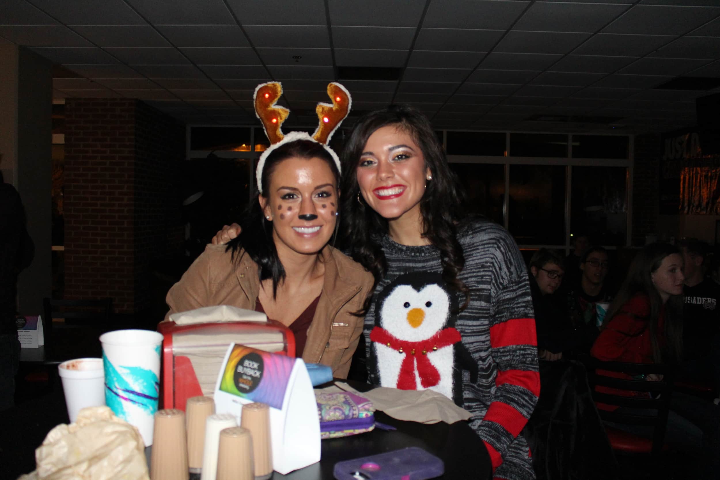 Emily Hambrick and Christal Potter soaking up the music and Christmas cheer.