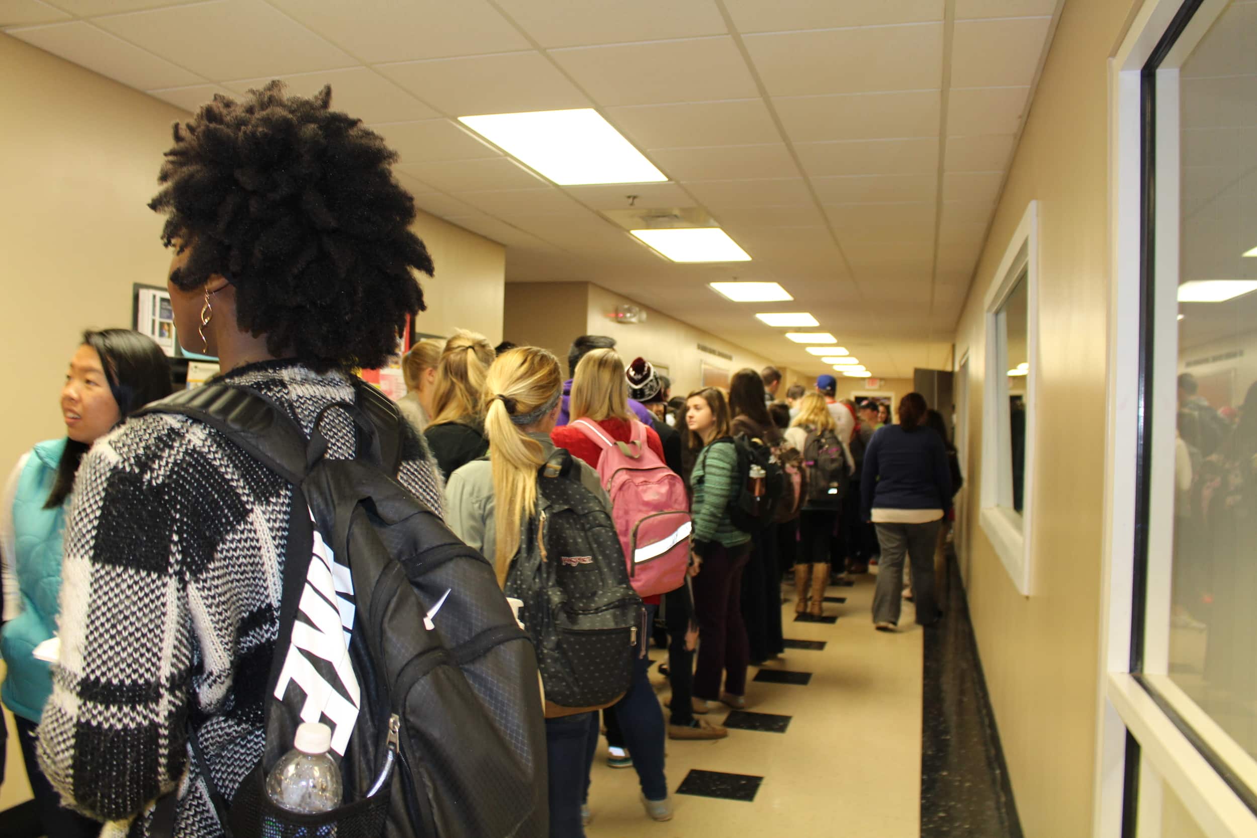 Students wait anxiously for the puppies on campus.