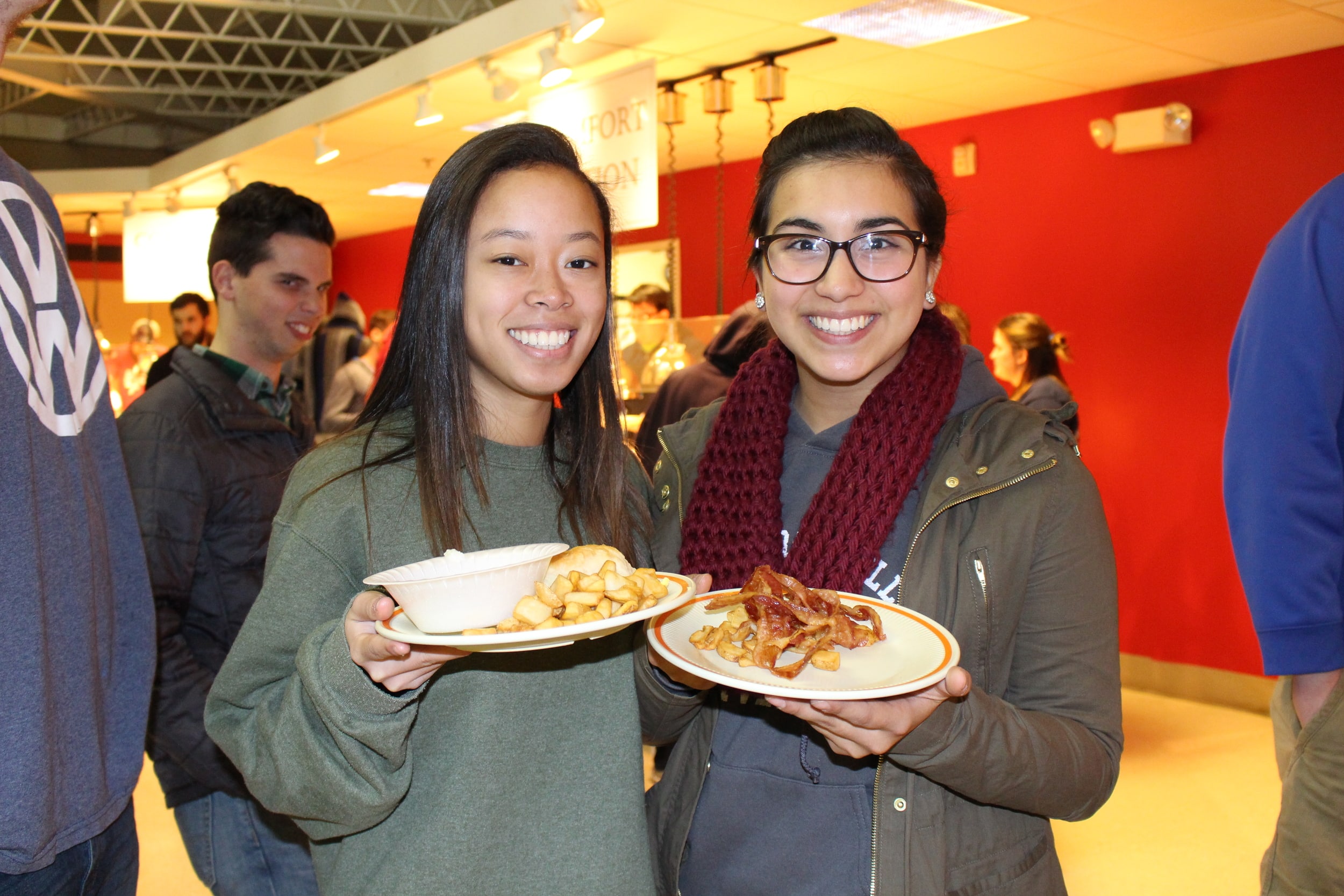 Allie Toy and Ashley Valencia waiting in line for pancakes on Thursday.