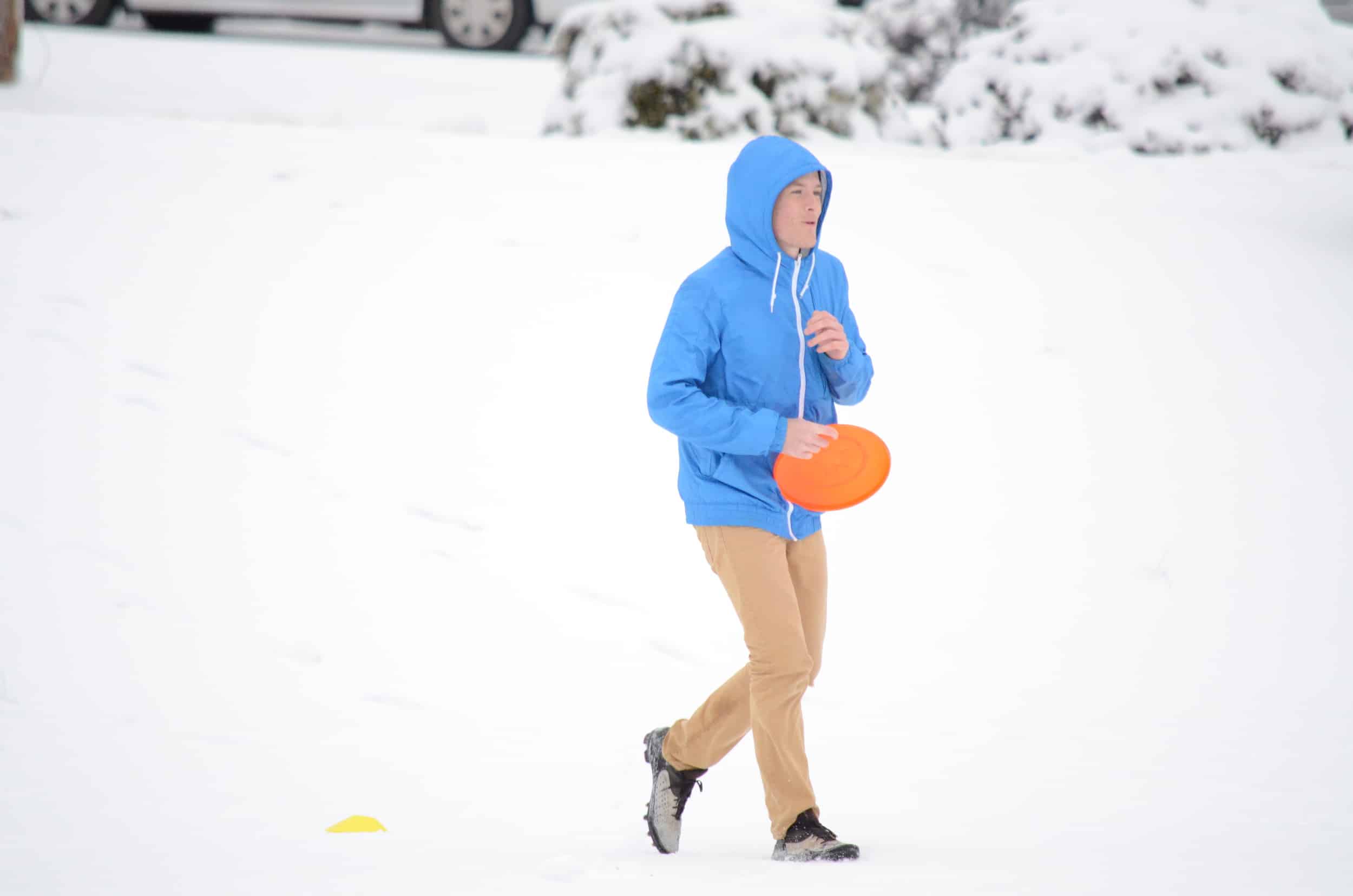 Is Tyler Ezsol really playing Frisbee in this freezing weather?Photo by: Rebecca Meek