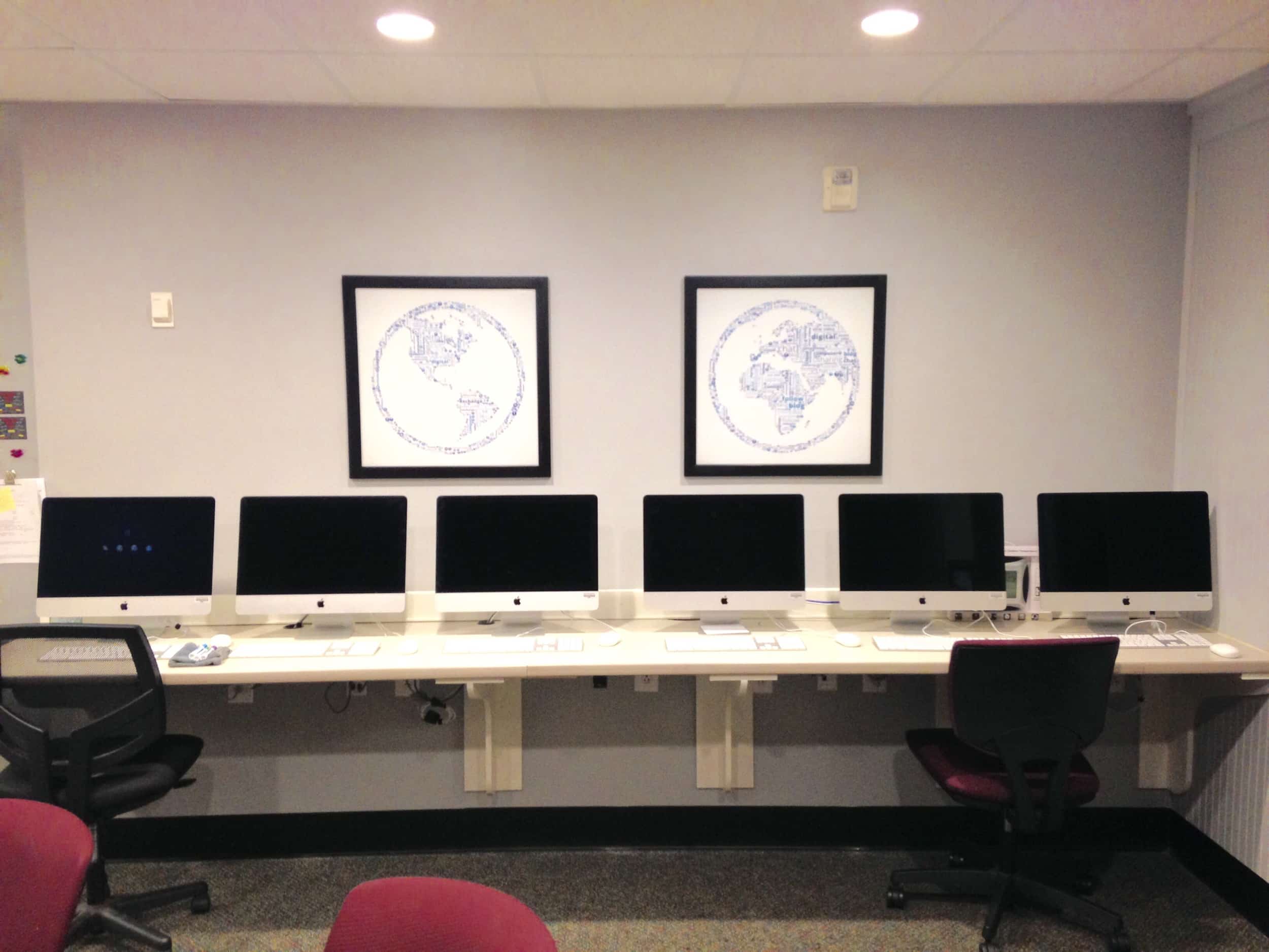 The digital media center is clean, modern and fully equipped with Macintosh desktop computers. The two pieces of wall art each contain a hidden NGU logo. See if you can find them next time you are in the Mass Communication department.&nbsp;