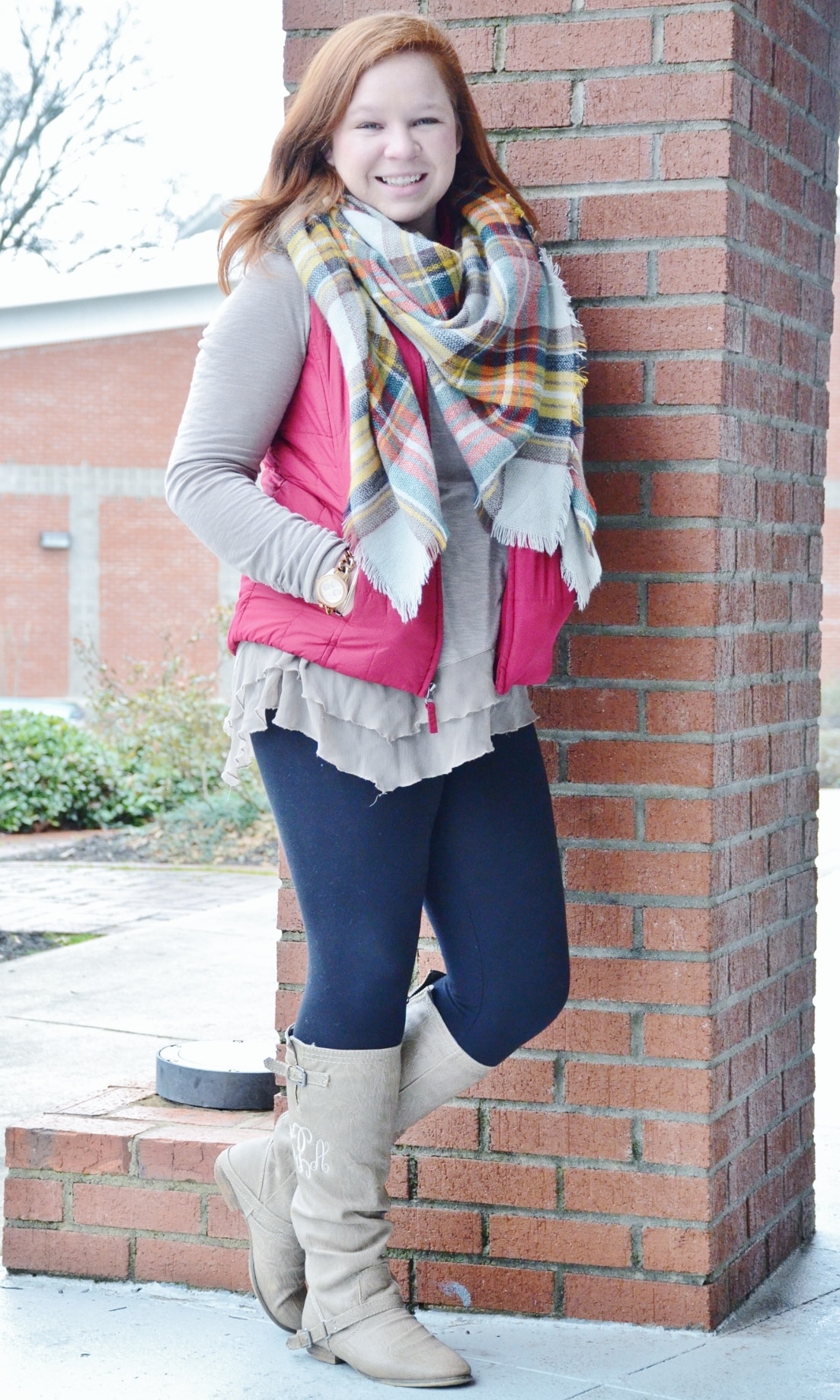 Carson Parnell knows just what to wear when it comes to staying warm. At first glance, it's hard to not notice the multi-colored blanket scarf from Girly Girl Boutique that matches her monogrammed winter boots from Almost Pink. And to put the look a