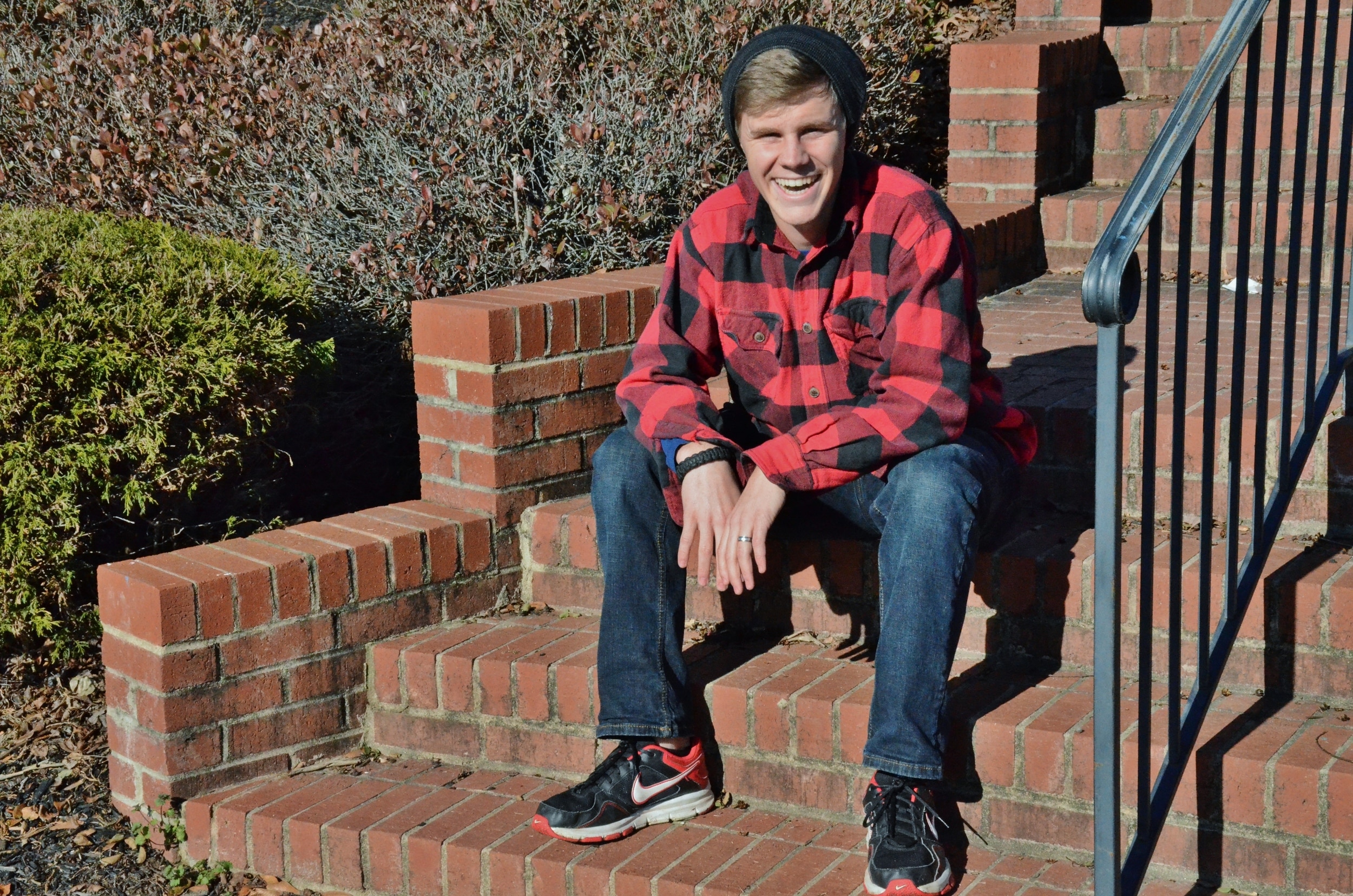 Jehu Jackson sports his casual winter outfit including blue jeans a red flannel long-sleeved shirt. Jackson said he bought his shoes from the Nike Store and most of his outfit he borrowed from his brother. Who doesn't love free stylish clothes?