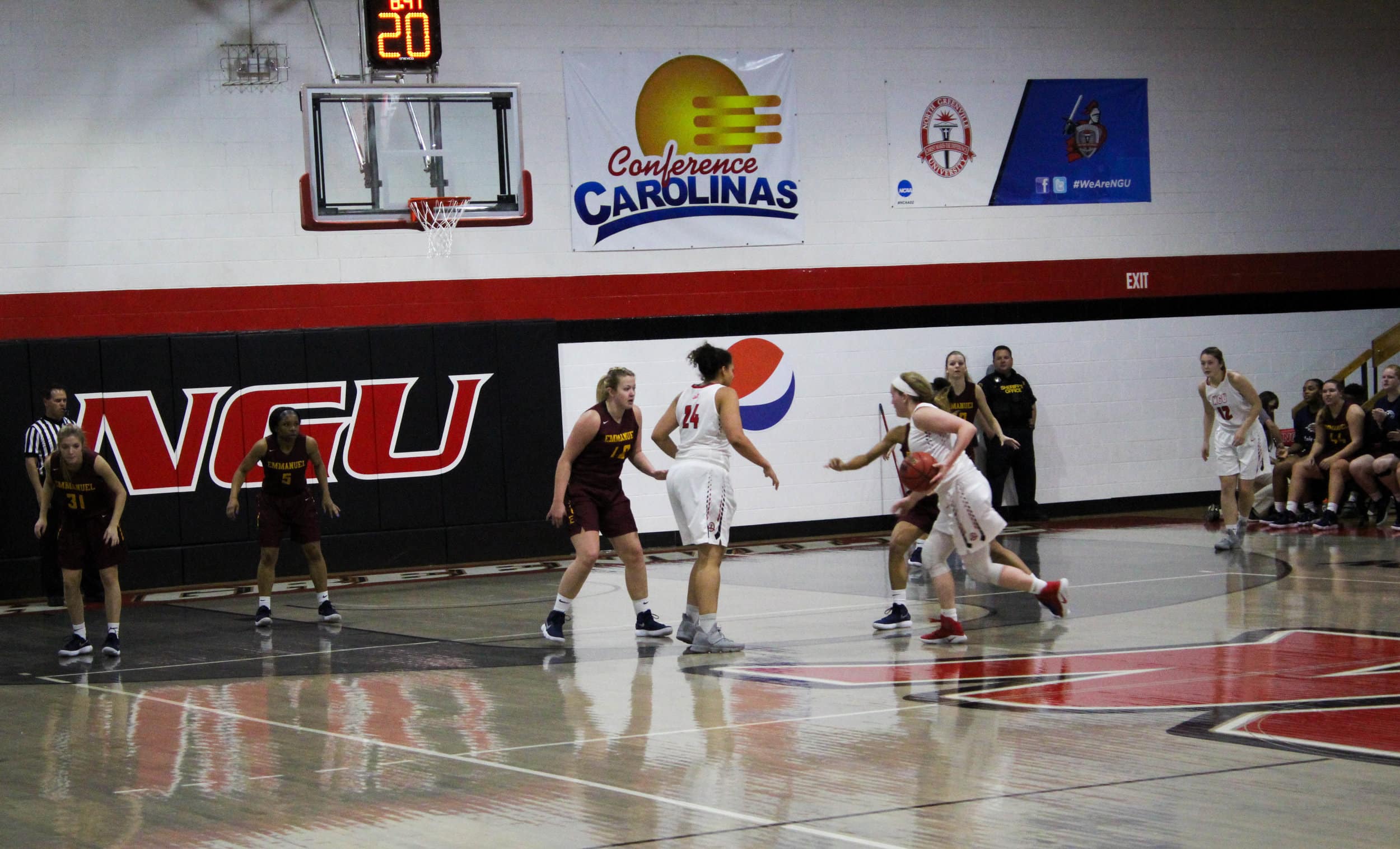 Karen Donehew (14) drives down the lane towards the basket.