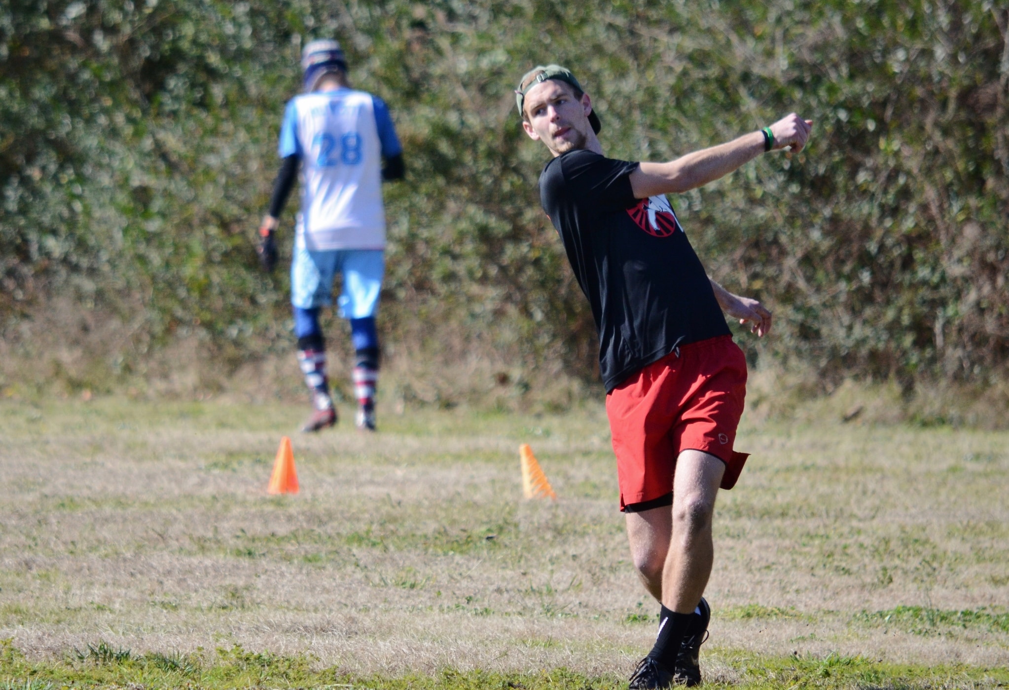 Tanner Furr pulls the disc to the other side of the field with all he has in him on this windy day.&nbsp;