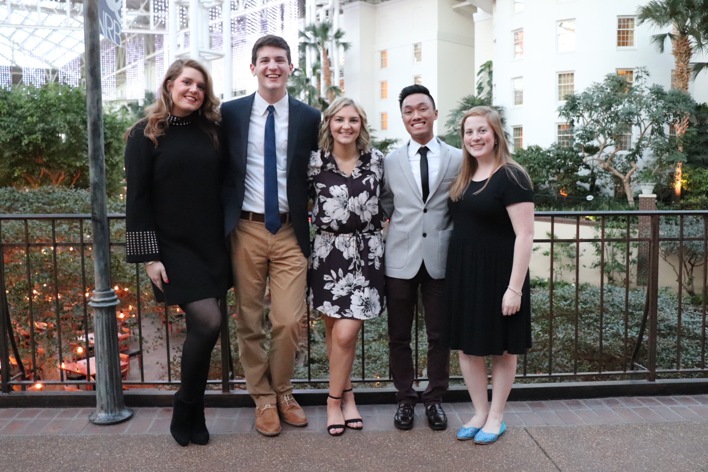 Junior Alexandra McNider, junior Clay Webb, junior Savannah Hovis, sophomore Adam Kelly and sophomore Mary Mahan pose for a picture before attending the closing gala dinner.