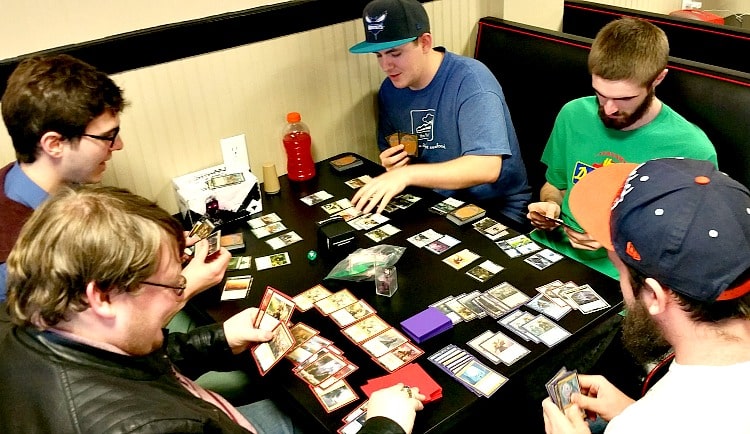 Brian Cordle (top-right)&nbsp;and the Gamers of the Round Table's officers,&nbsp;Samuel Maycock (top-left), Mitchell McDaniel, (bottom-left), Michael Miller (middle-right) and Robzy Bolin (bottom-right) playing Magic the Gathering. &nbsp;Photo court