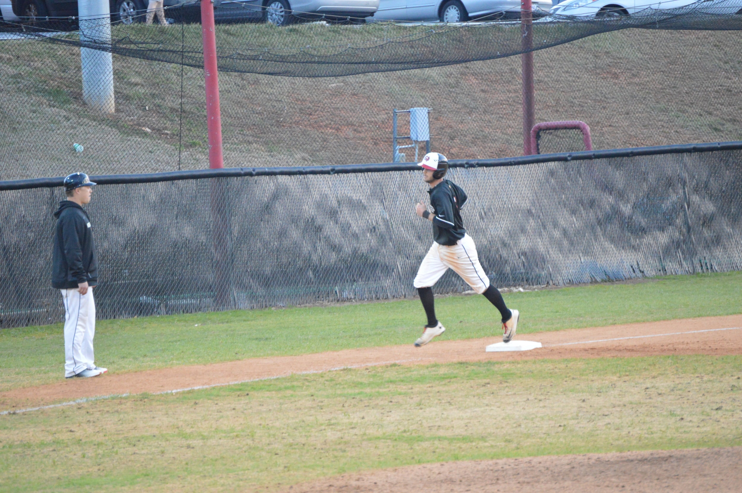 Andrew Frazier runs from third base to home plate to get the point for their team.