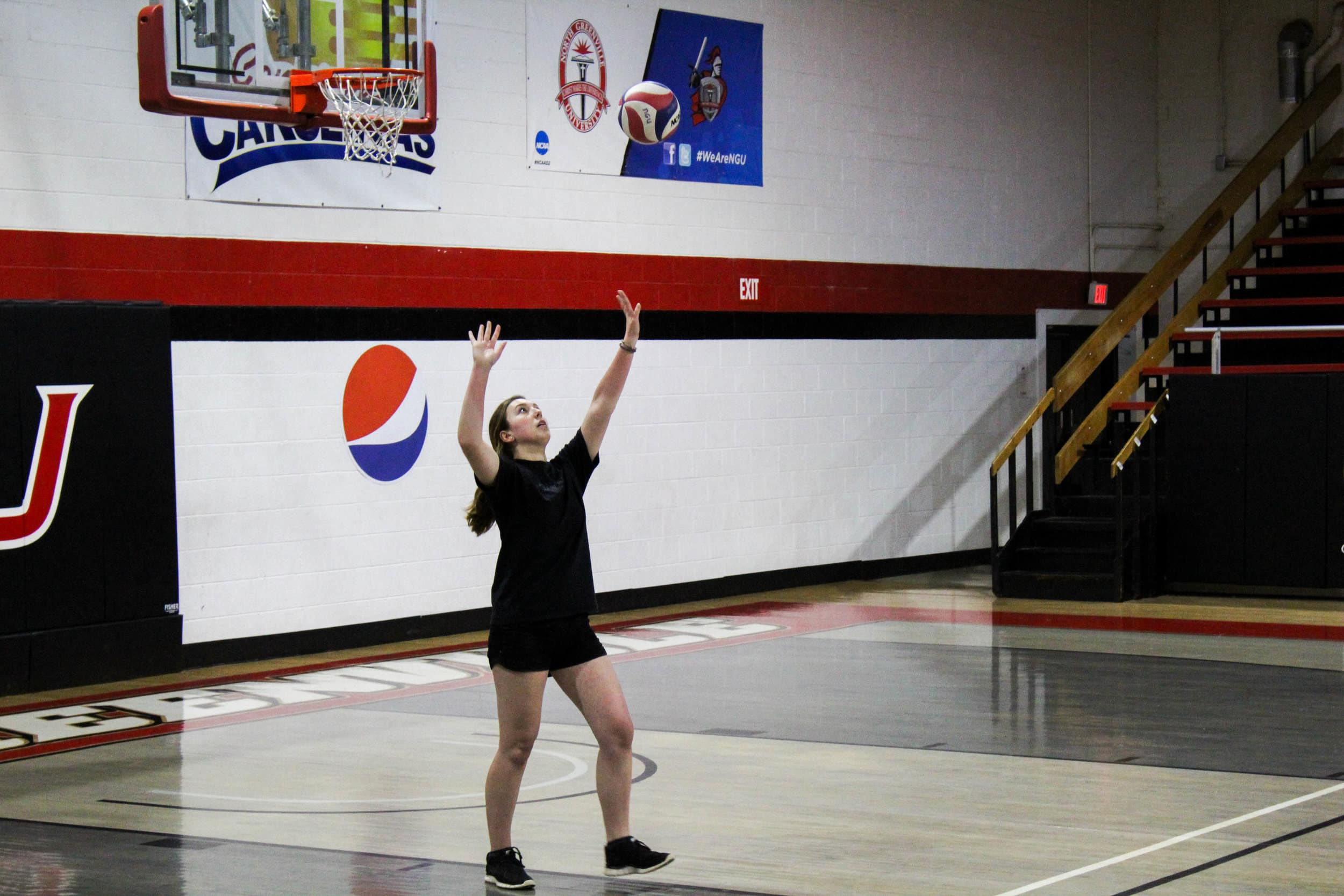 Lauren Dibble serves the ball over the net successfully to Who let the Dawgs out!?