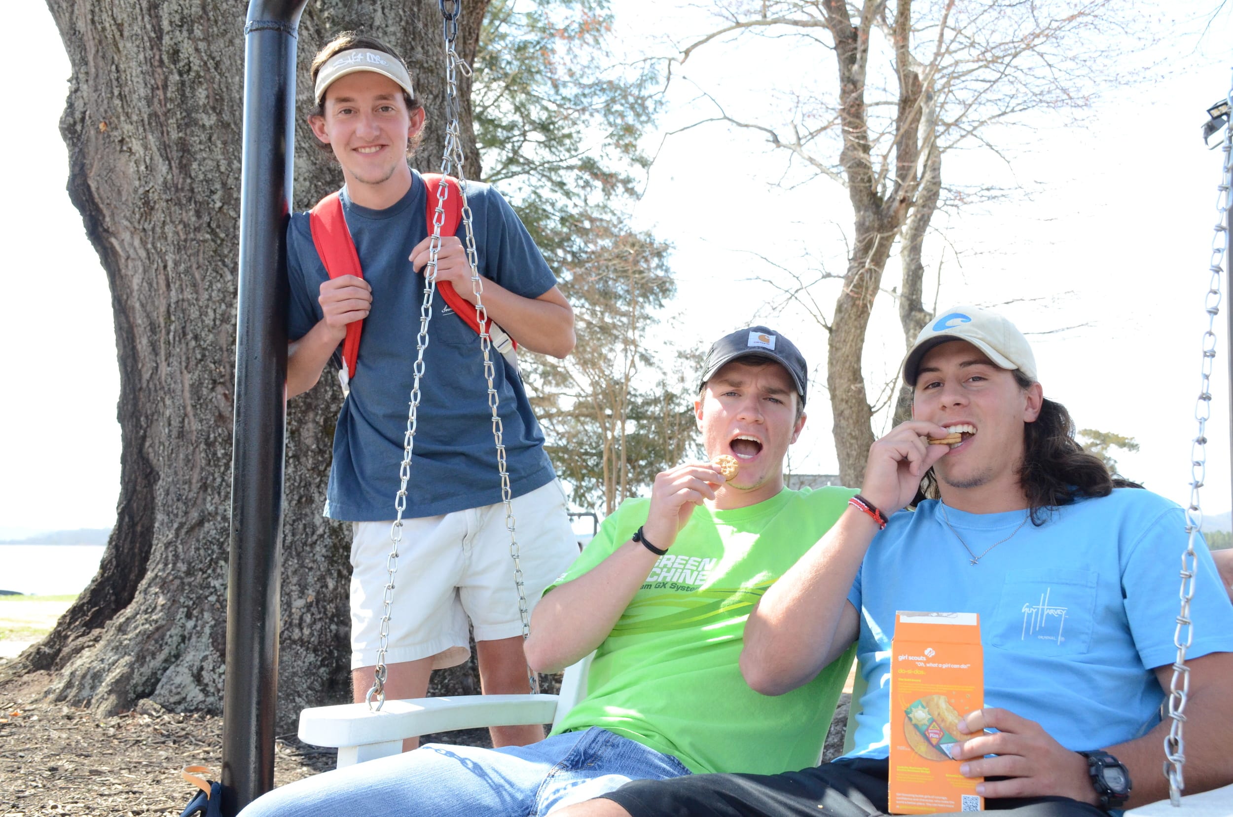 Andrew Woods, Kyle Henry and Tucker Barnes spend time swinging and eating tasty cookies on a warm day.&nbsp;&nbsp;