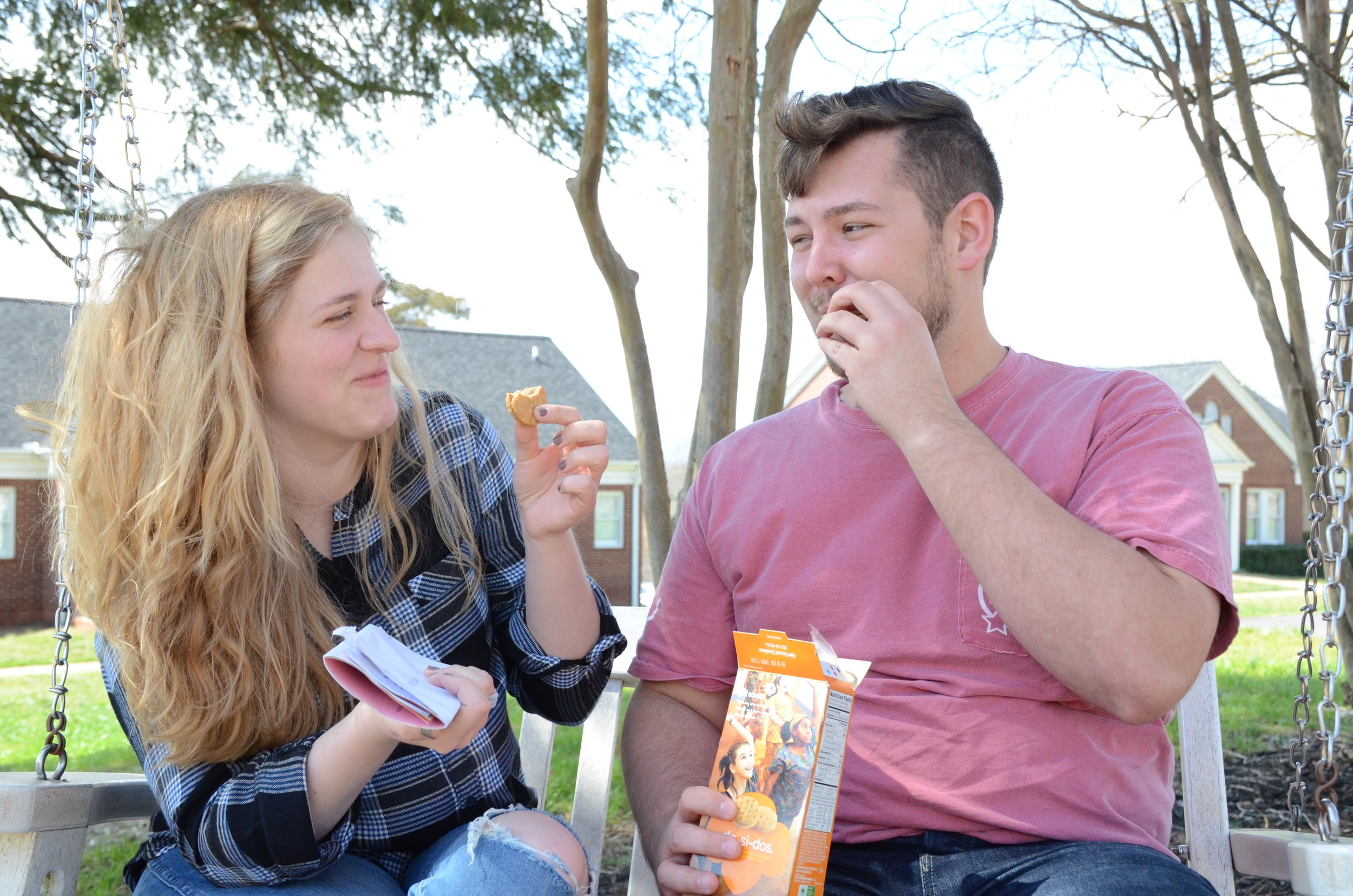 Helen Martin and Zach Grey have fun while eating Do-Si-Dos.
