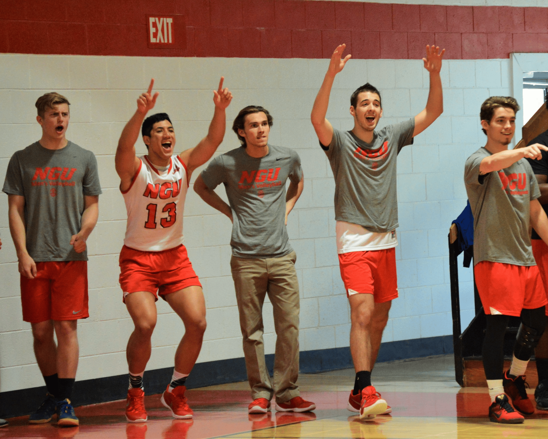 Andrew Sorton, Luuga Vailuu, Luke Cabe, Grayson Lawrence and Silas Jenkins cheer for the team from the sidelines.