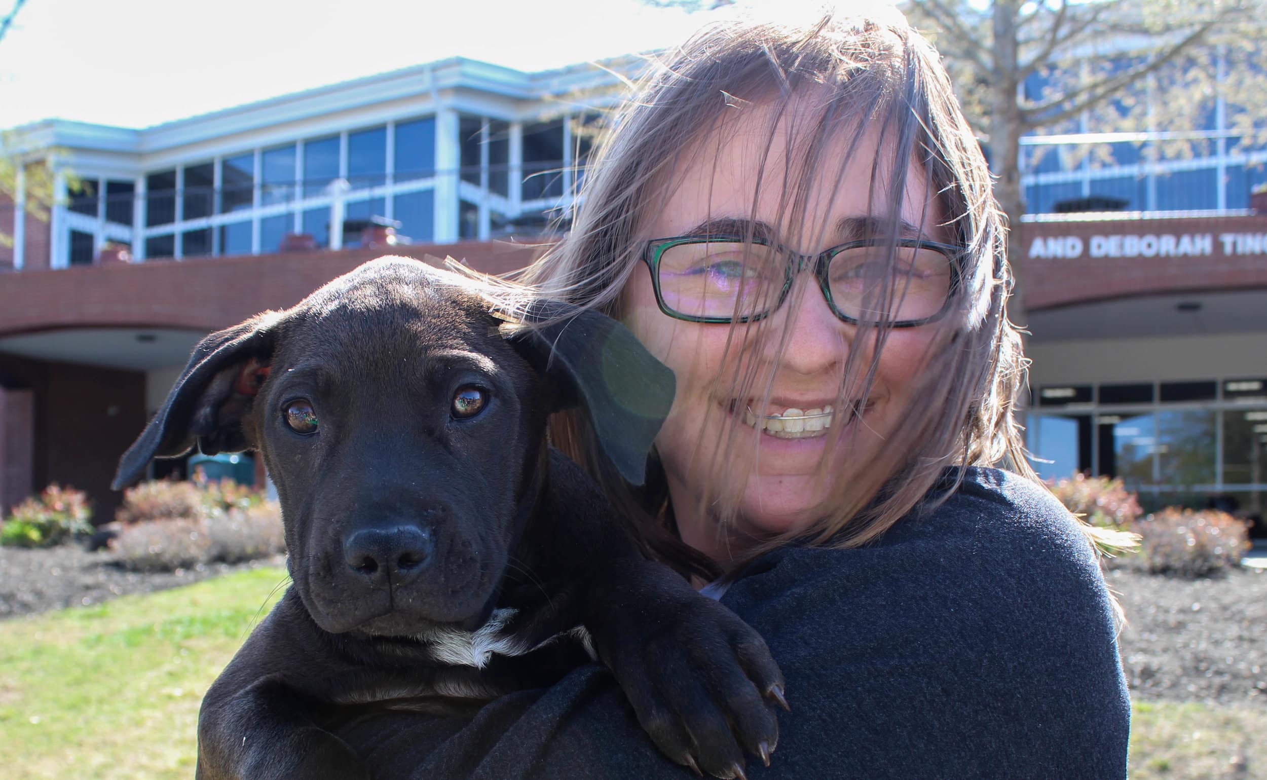 Early childhood education major Marissa Holst supports the Healing Species Rescue by coming to the puppy day.