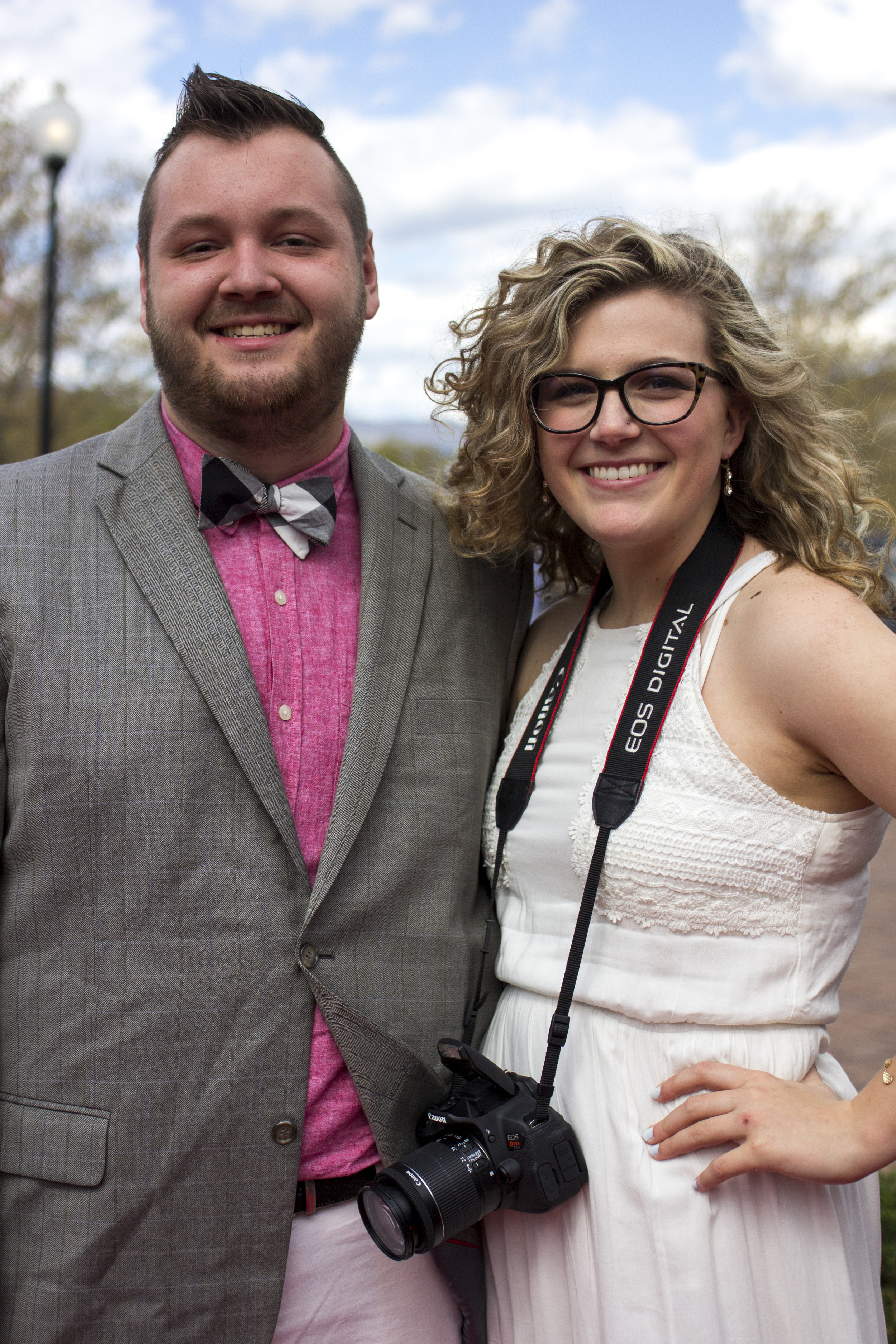 Carli Frady takes a break from taking pictures to have her own red carpet moment with Adam Polk.&nbsp;