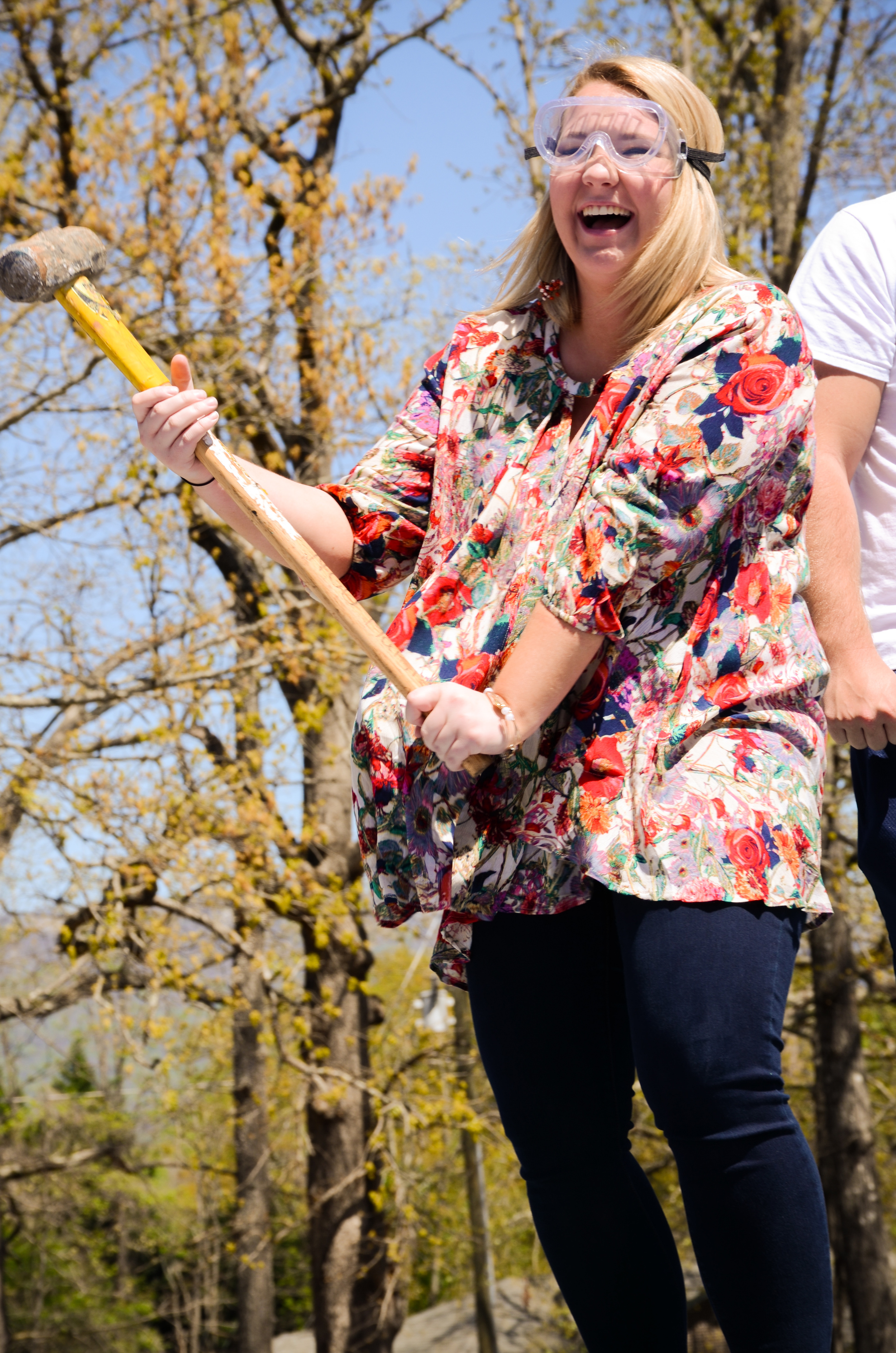 Dresses and nice clothes can't stop Mimi McWhite while she takes out her stress on an old car.&nbsp;