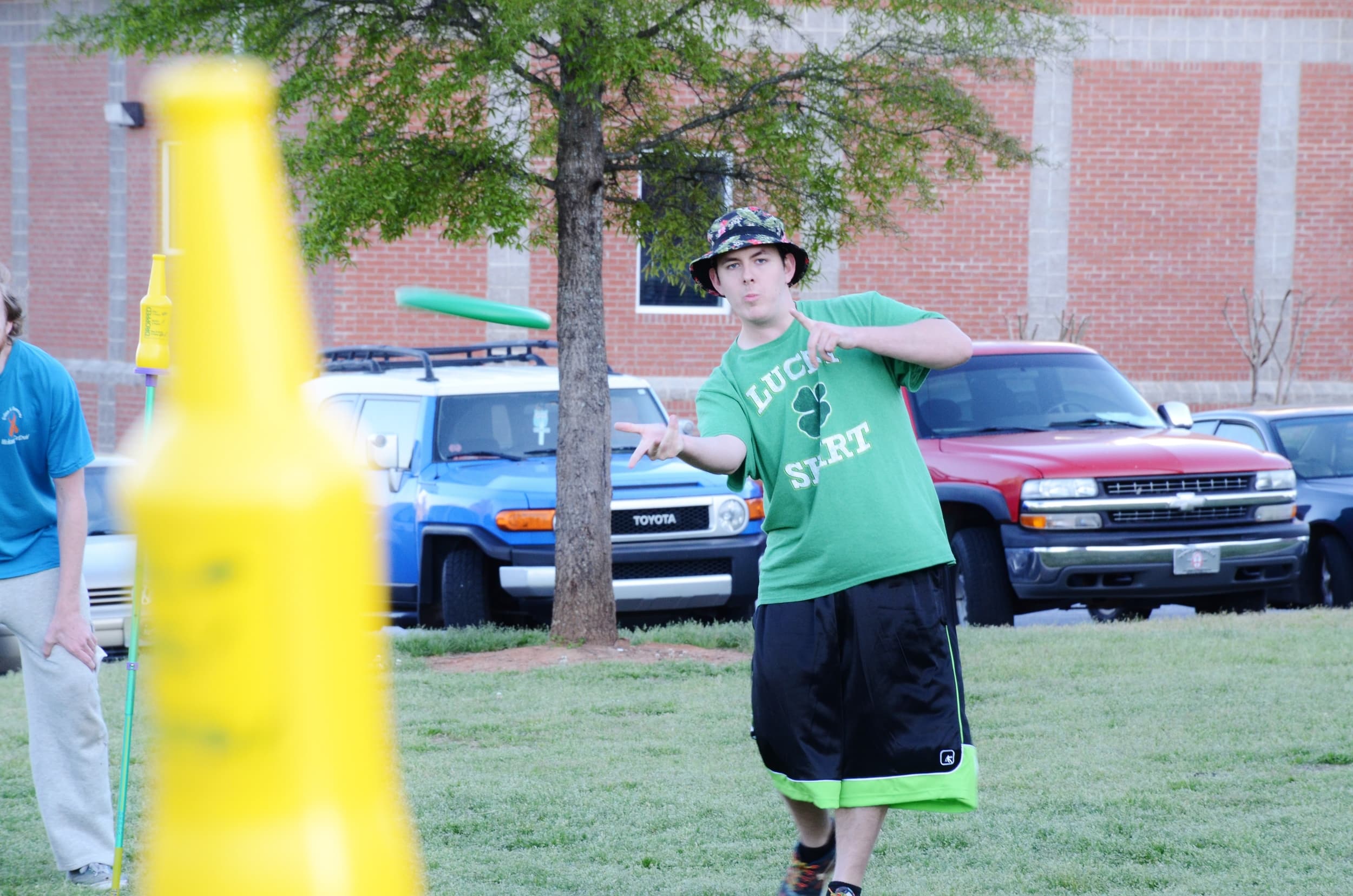 Brian Cordle shows his frisbee skills as he tries to knock down a bottle in a game of Polish.&nbsp;