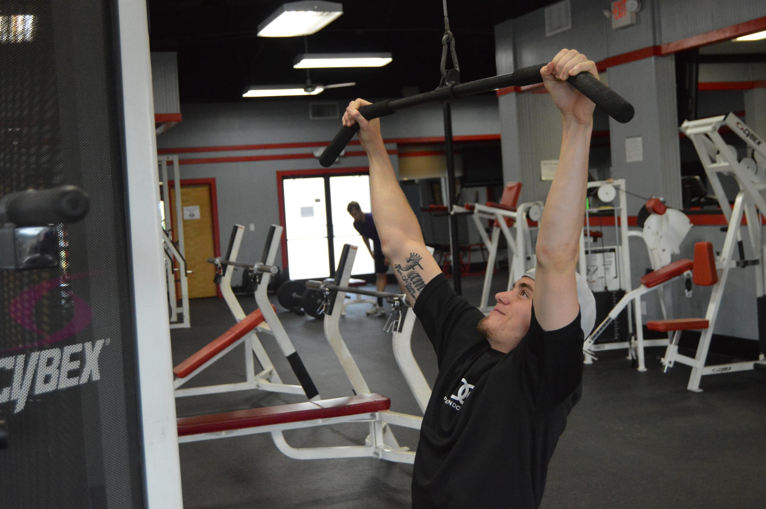 The lat pulldown machine works your back muscles. Try completing three sets of 20 reps to sculpt your back!&nbsp;