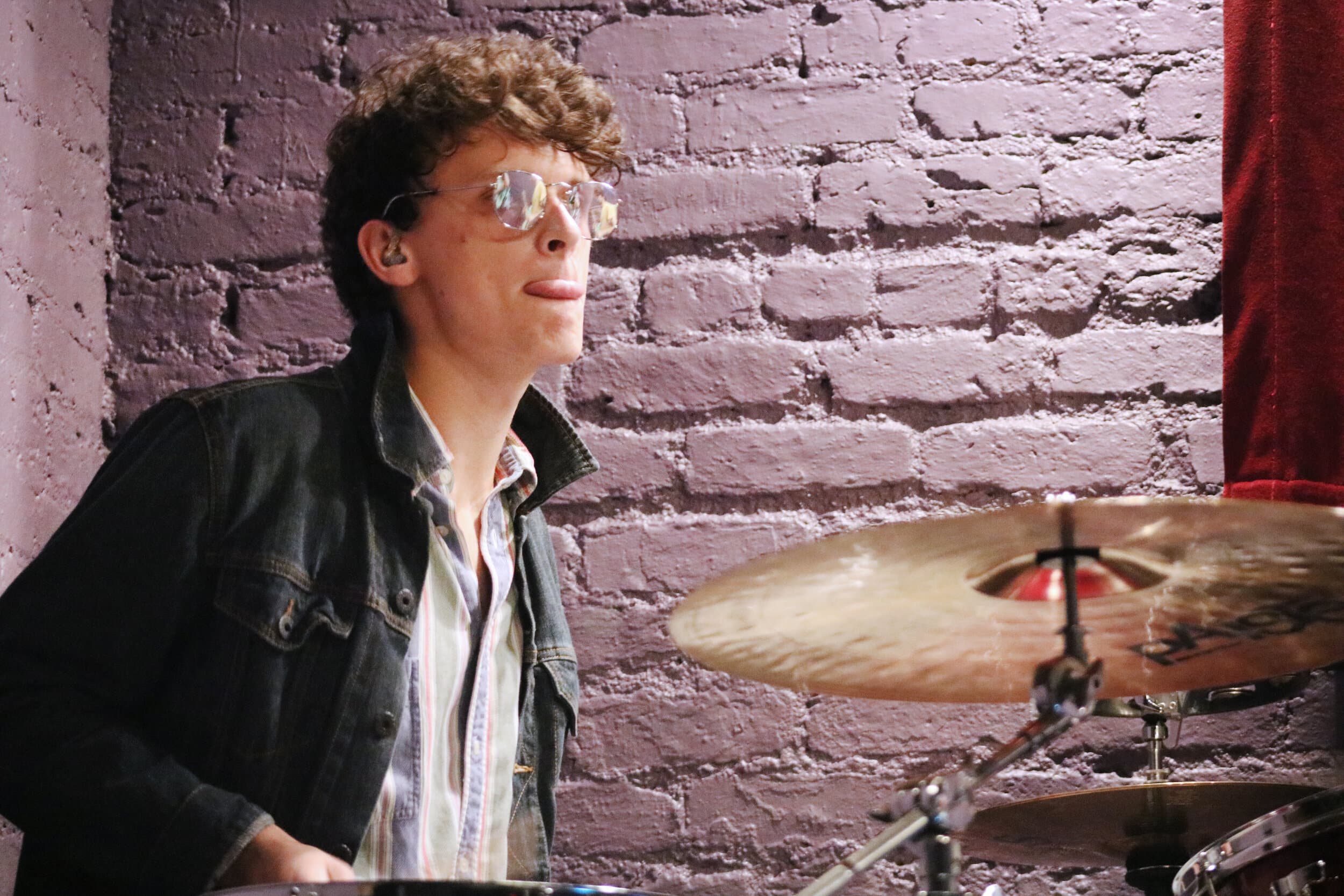 M. Martin wears his shades and concentrates during the first song of the night.