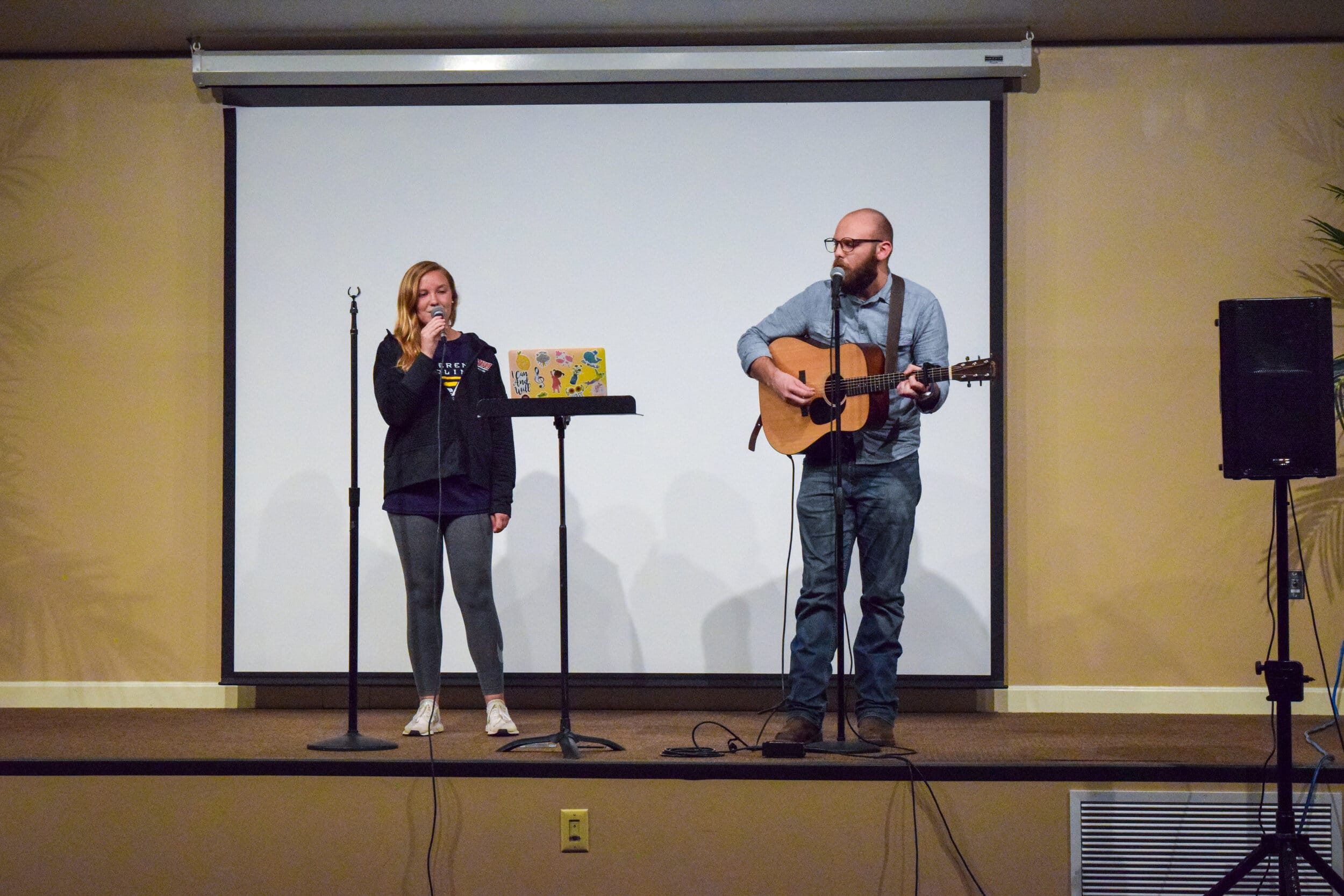 Merit Morgan, senior broadcast media major, and Jacob Hudson, senior English major, sing a duet.&nbsp;&nbsp;