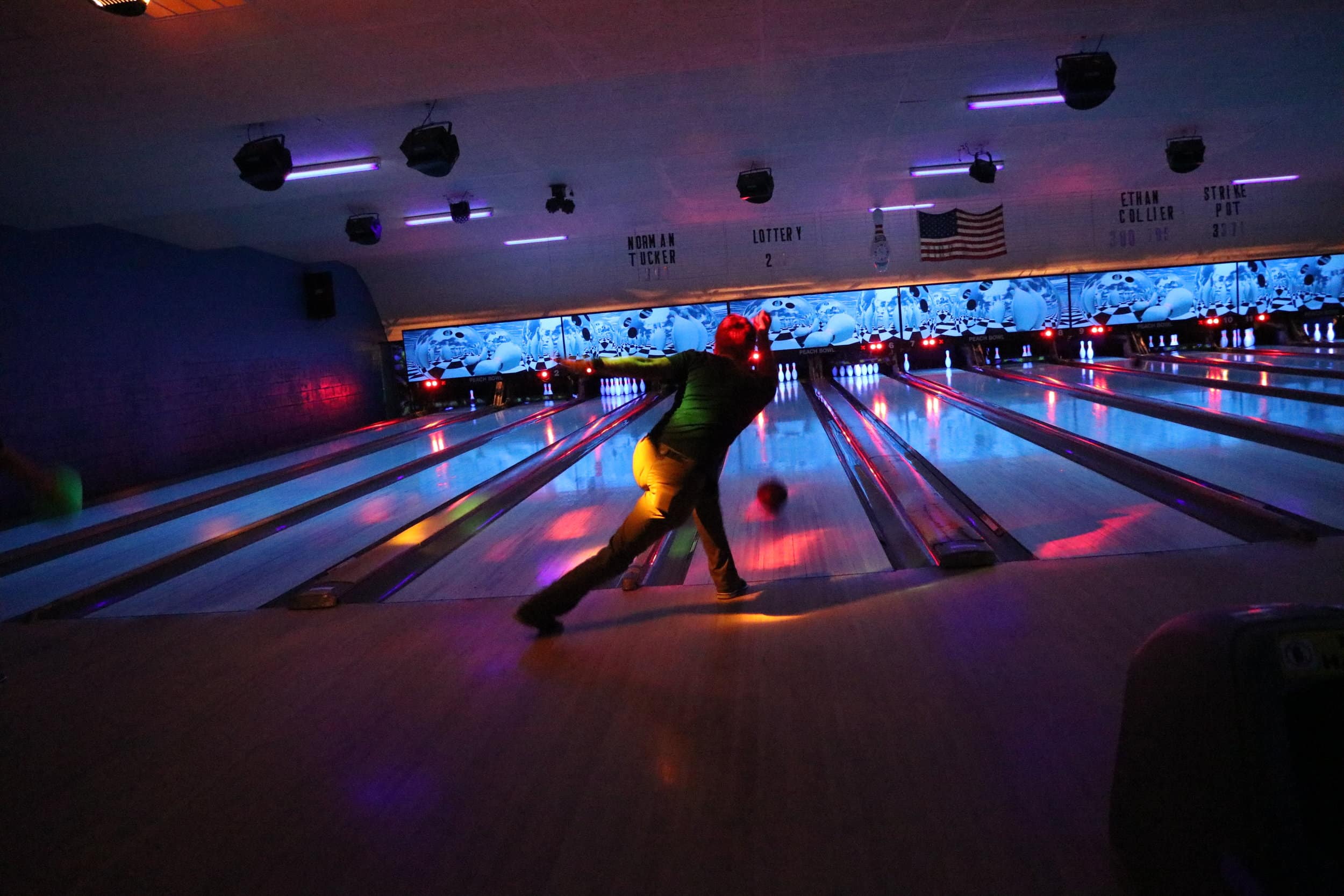 Junior, Carson Floyd, shows off his skills as he attempts to roll a strike.