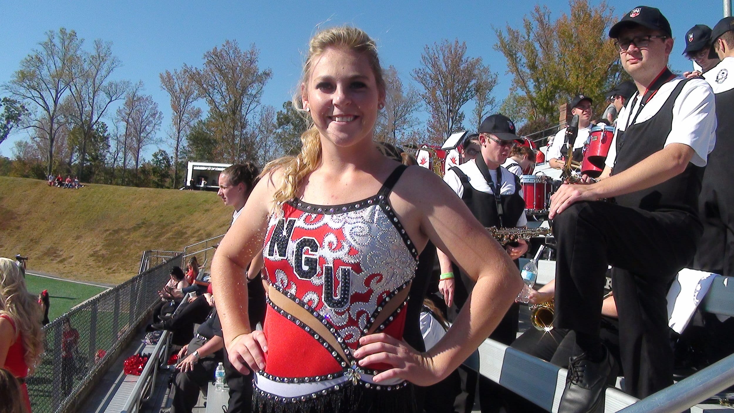  A member of NGU's color guard, Rachel Huber, joins in with the Crusader victory.&nbsp; 