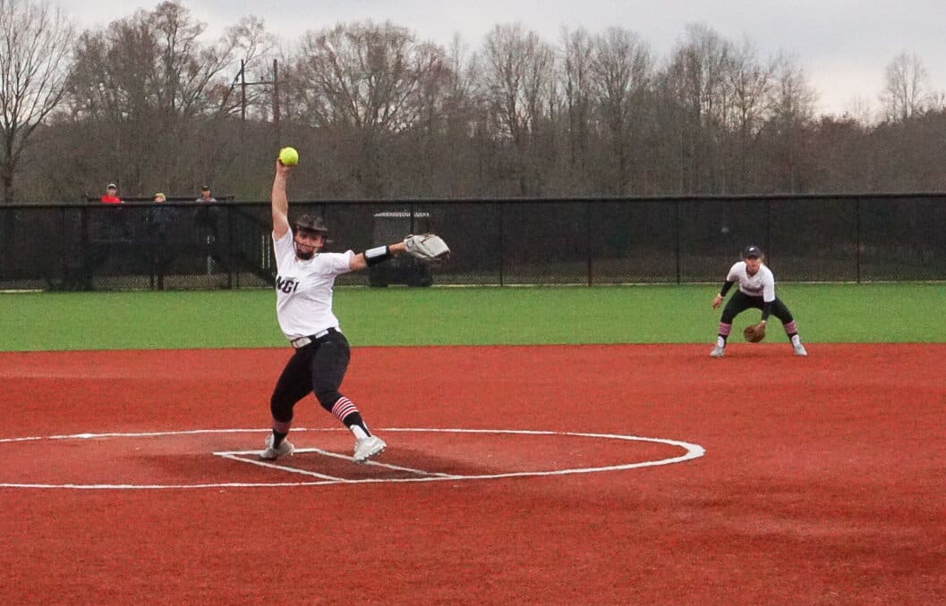 Sophomore Hailey Wells pitches the ball.