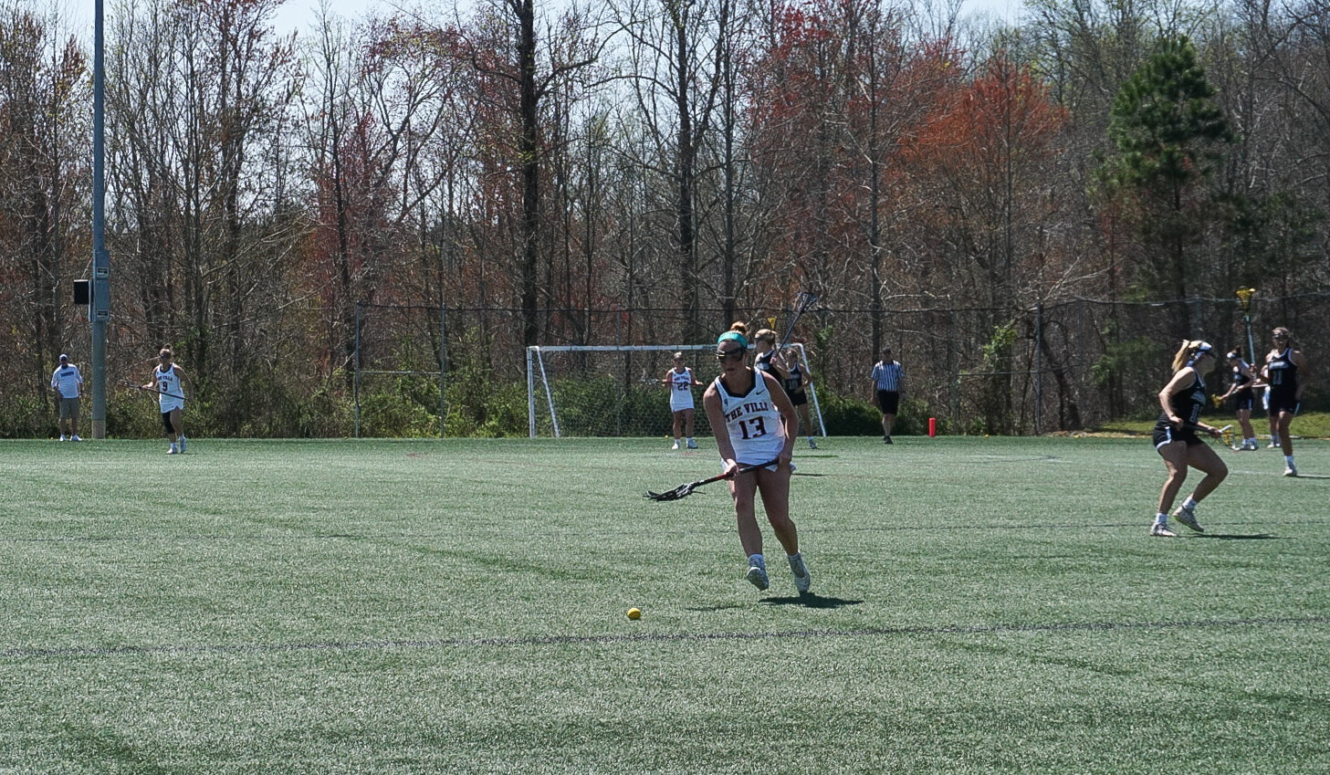 Sophomore Kaitlin OBrien runs to pick up the ball and take it back to the chargers goal.