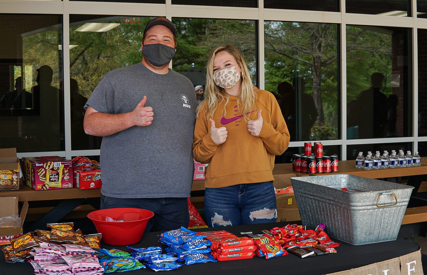 Graduate assistant Blake Patron and junior Logan Jolley are ready to give out snacks and treats.