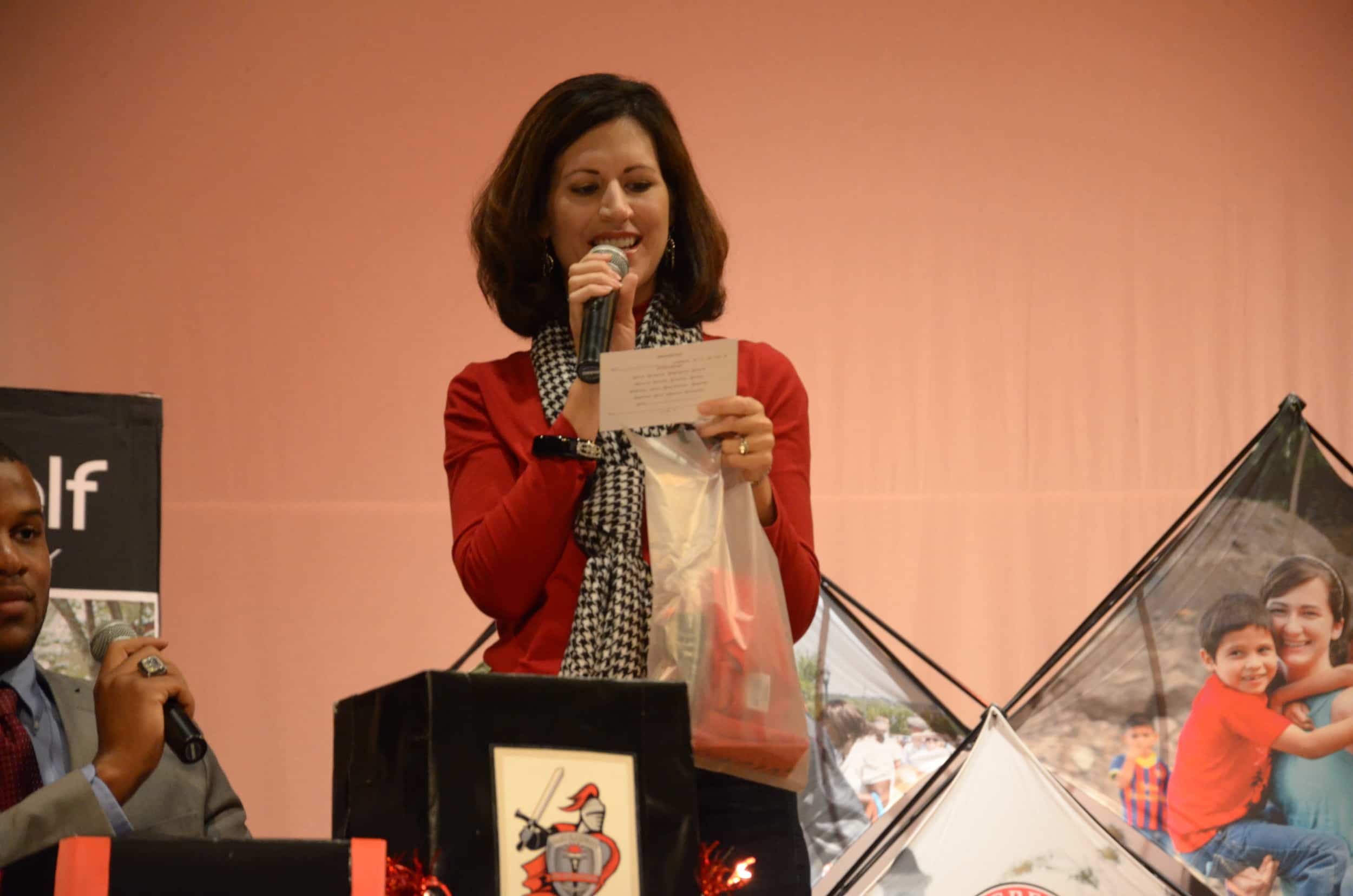  Ansley Welchel, Mass Communications Instructor, selects a winner of an NGU T-shirt and some other goodies at Saturday's Encounter Day. 