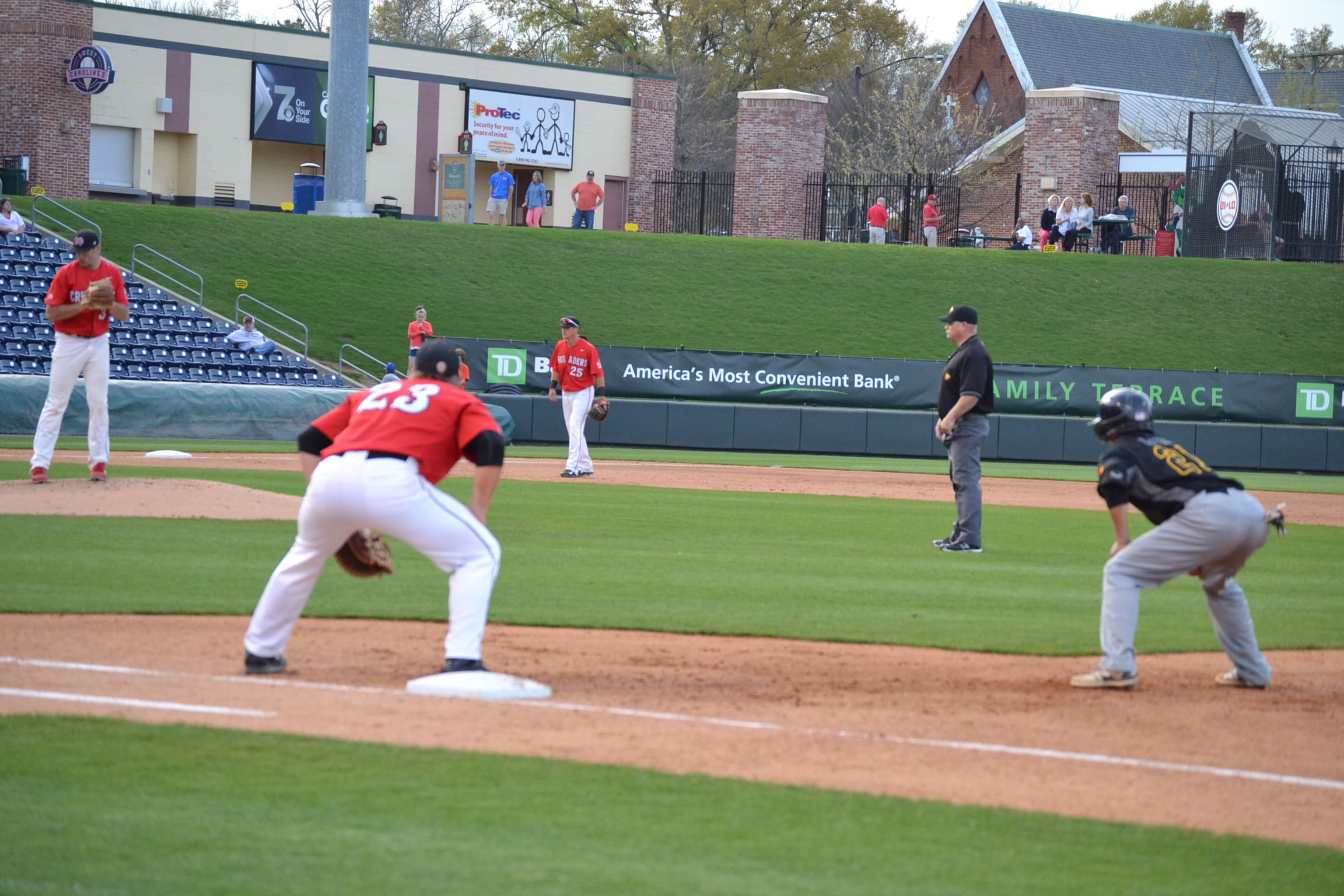  Taylor McCuen, first baseman from Traveler's Rest, watches the pitcher and Pfeiffer University's player&nbsp;intently. 