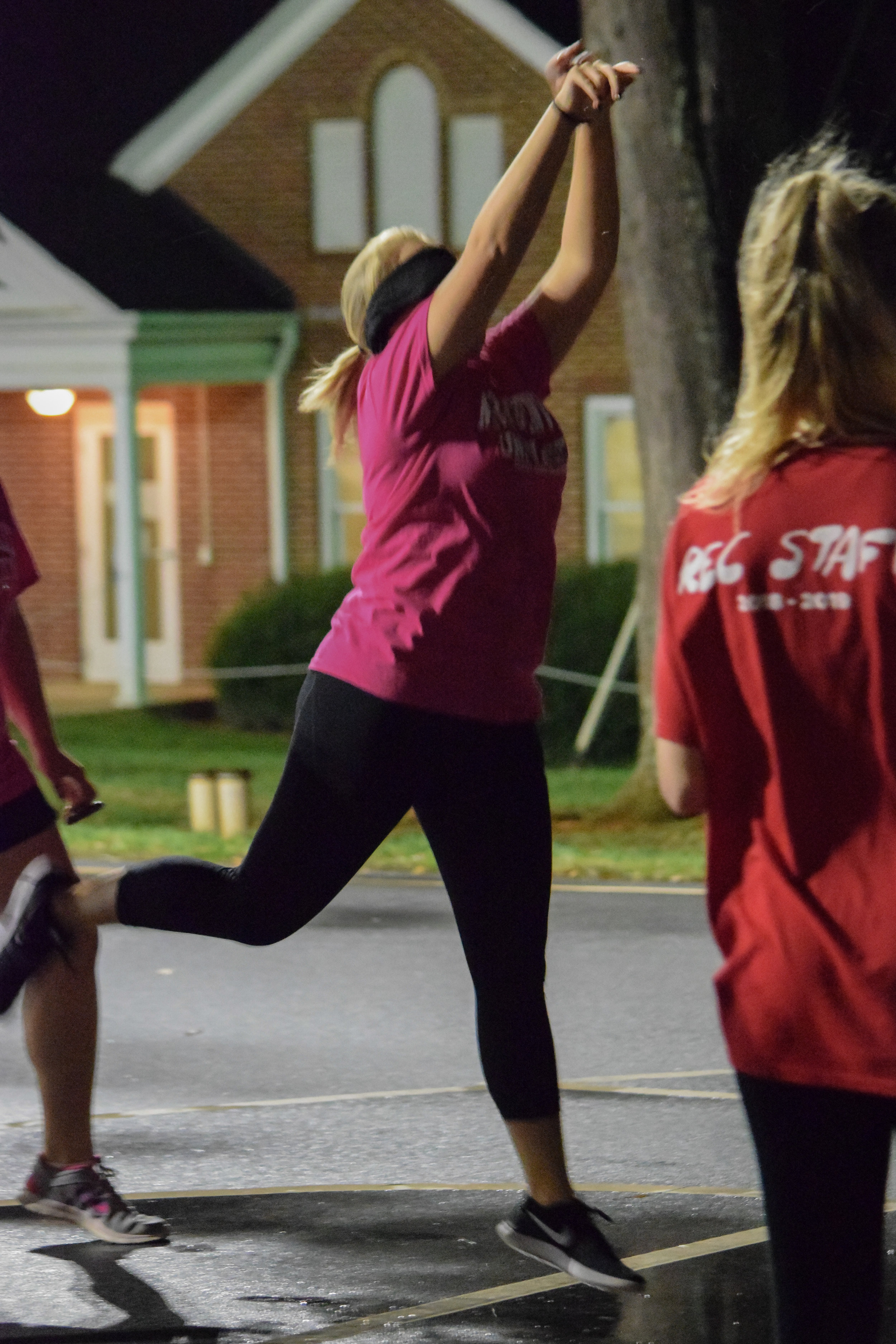 Big and Little club member Mary Collins, sophomore, makes the effort to make a basket in ten shots while blindfolded.