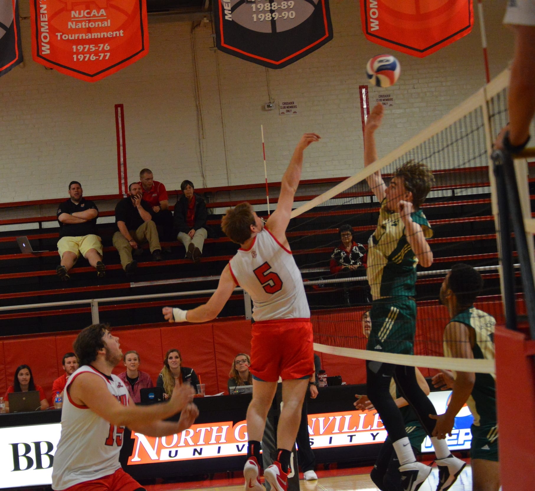 Alexander Schinzing tips the ball over the net.