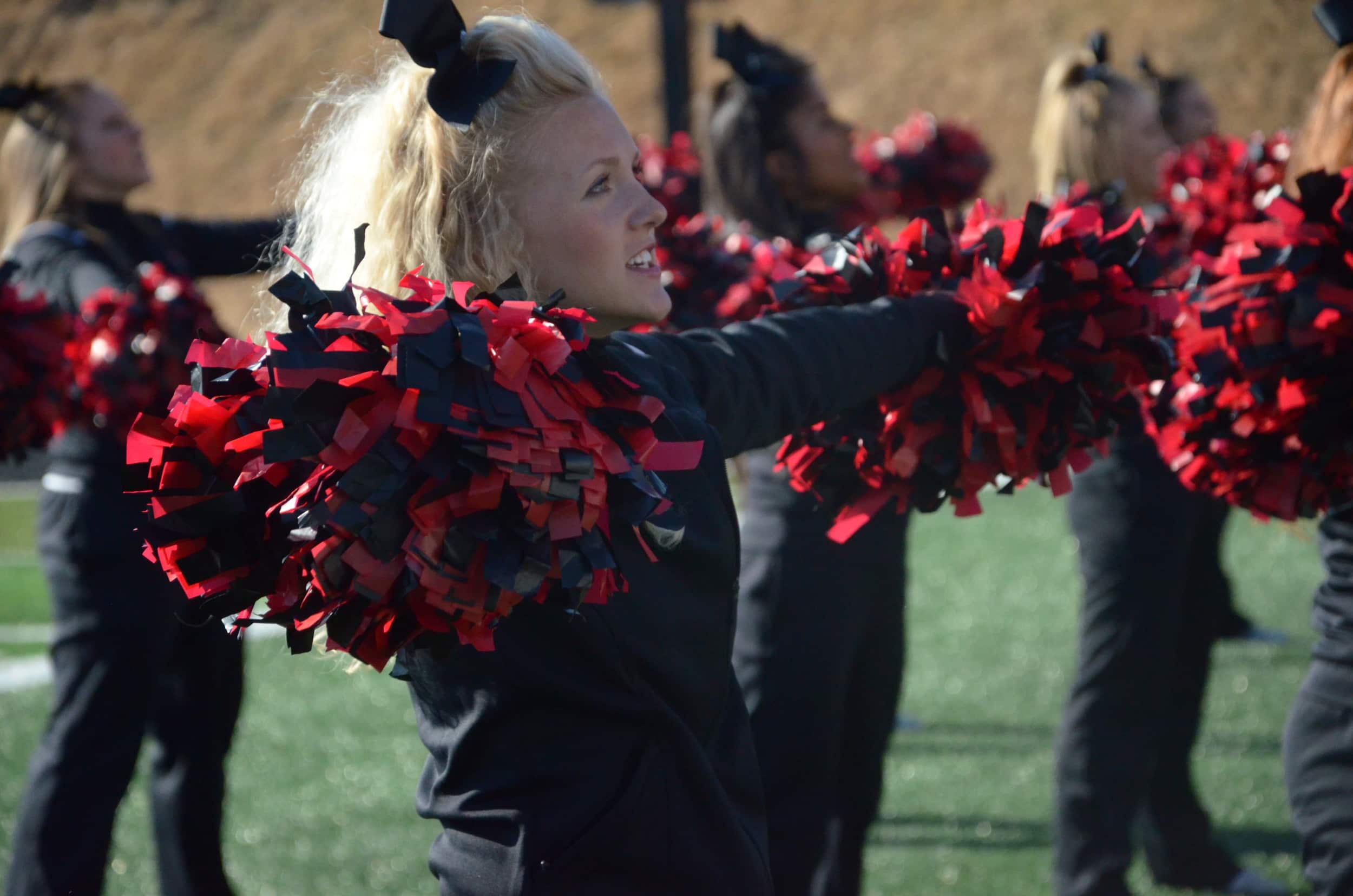  An NGU cheerleader is happy to help the crowd root for the Crusaders. 