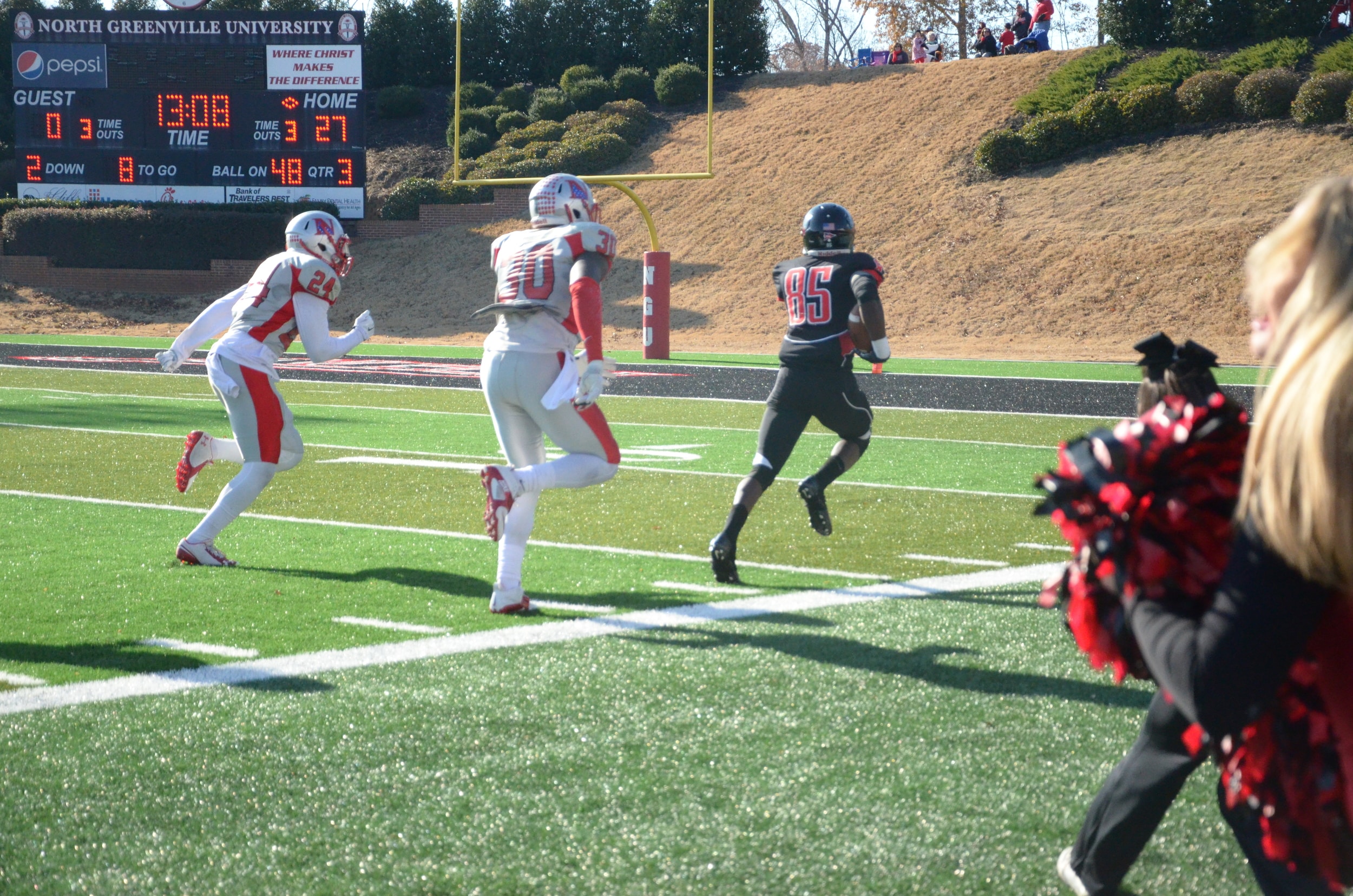  Number 85, Robbie Brown, makes a mad dash for the end zone. 